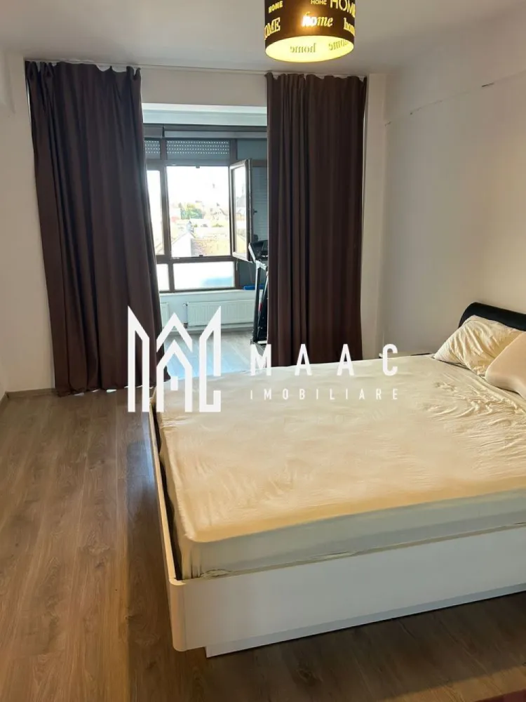 Apartament Ultracentral | 2 camere | 95 mp utili - MAAC Imobiliare vă propune spre inchiriere un apartament modern cu o locație excelentă, situat la doar câteva minute de Centrul orașului Sibiu și de noul Mall, în apropiere de Autogară și Gară.

 Detalii apartament:
Suprafață utilă: 95 mp
Compartimentare: Living generos + Dormitor spațios
2 băi moderne
Mobilat și utilat complet
2 unități aer condiționat
Electrocasnice premium: mașină de spălat AEG, uscător de rufe, mașină de spălat vase
Clădire dotată cu lift modern

 Avantaje și facilități:
Living amplu, perfect pentru relaxare și timp petrecut cu familia
Dormitor luminos, cu suficient spațiu pentru un pat matrimonial și mobilier
Priveliște spectaculoasă spre Centrul orașului și Dealul Gușteriței
Locație centrală, cu acces rapid la școli, magazine, mijloace de transport și zone de interes
Doar 5 minute de mers pe jos până în Piața Mare

📞Contactează-ne pentru mai multe detalii sau pentru a programa o vizionare, menționați CP2681746!