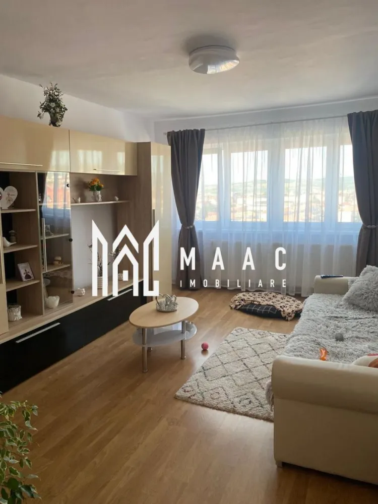Apartament 2 camere | 55 MPU | Pivnita | Balcon | Bulevardul Mihai Viteazul - MAAC Imobiliare vă propune spre vânzare un apartament modern cu 2 camere, situat pe Bulevardul Mihai Viteazul, la etajul 10/10, cu vedere superbă spre Munții Făgăraș.

Detalii apartament:

Suprafață utilă: 55 mp
Balcon închis: 12 mp – spațiu generos pentru relaxare sau depozitare
Compartimentare: decomandată, practică și luminoasă
Etaj: 10/10 (bloc dotat cu lift)

Dotări și finisaje:

Apartament complet renovat și mobilat modern
Centrală termică proprie
Geamuri termopan pentru izolare fonică și termică
Finisaje de calitate, pregătit pentru mutare imediată

 Avantaje:

Vedere panoramică spre munți
Lumină naturală din plin, datorită poziționării excelente
Zonă centrală, cu toate facilitățile la doar câțiva pași: magazine, farmacii, transport public, școli
Acces rapid către centrul orașului – doar 1,4 km de Piața Mare (3–4 minute cu mașina sau 15–20 minute de mers pe jos)

Pentru mai multe detalii sau pentru a programa o vizionare, contactați-ne specificand ID: CP2681539