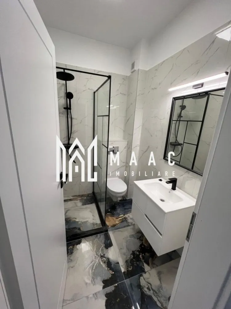 Apartament 2 camere | 54 Mp | Parter | Boxa | Selimbar zona Brana - MAAC Imobiliare vă prezintă un apartament în ansamblul Casian Renaissance – Șelimbăr, zona Brana
📍 Locație excelentă – la doar câteva minute de centrul comercial Shopping City Sibiu, într-o zonă liniștită și bine conectată din Șelimbăr.

 Acces facil din Sibiu:

Strada Ștefan cel Mare
Strada Octavian Goga (Șelimbăr)
Strada P. Brana

 Toate drumurile sunt asfaltate, iar infrastructura este complet amenajată.

 Despre proiectul Casian Renaissance:
Un concept rezidențial premium, gândit pentru cei care își doresc calitate, confort, siguranță și eleganță într-un cadru modern și bine organizat.

Proiectul cuprinde:

6 imobile de tip P+3, fiecare dotat cu lifturi moderne
Un total de 256 unități locative, inclusiv:

Garsoniere
Apartamente cu 2 camere
Apartamente cu 3 camere

 Facilități și avantaje:

 Design arhitectural deosebit – fațade placate cu profile ornamentale (interior & exterior)
 Lifturi performante în fiecare bloc
 Alei de promenadă și spații verzi generoase
 Loc de joacă pentru copii
 Locuri de parcare amenajate
 Iluminat stradal modern
 Construcție solidă, cu finisaje premium și materiale de calitate

 De ce să alegi Casian Renaissance?

✅ Stil arhitectural elegant
✅ Accesibilitate excelentă
✅ Confort urban într-un cadru relaxant
✅ Locuințe spațioase și bine compartimentate
✅ Un stil de viață modern, liniștit și sigur

📞 Pentru detalii și programarea unei vizionări, te rugăm să ne contactezi specificând ID :CP2613911