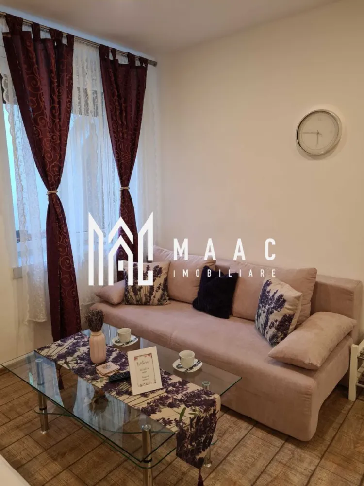 Garsoniera/ Studio | Investitie | Ultracentral - MAAC Imobiliare ofera spre vanzare apartament cu 1 camera elegant, complet mobilat si utilat, in zona Ultracentrala (la 1 minut de mers pe jos de inima orasului, Piata Mare).

Locuinta se afla la parterul unui imobil izolat si bine pozitionat cu regim de inaltime P+2, este alcatuita dintr-o incapere cu pat matrimonial si canapea extensibila, baie moderna si bucatarie cu toate facilitatile. 

Se afla intr-o curte comuna cu 4 locatari, avand geam la curte. Langa cafeneaua 5TOGO. Locatia este linistita, primitoare si aranjata modern.

Amplasamentul imobilului este unul avantajos, aflandu-se la 5 minute de mers pe jos de spital, centru si Promenada Mall.

Locația este dotata cu:
- Sistem smart de intrare pe poarta principala cu cod unic si safe separat unde se afla cheile de intrare, pe holul principal.
- Saltea Gama Hoteliera Super Ortopedica Memory, Biomedical 180x200 cm - Este o saltea silentioasa, ferma, fara arcuri, având un confort deosebit. 
- Canapea extensibila 3 locuri cu suprafata de dormit: 144x194 cm 
- Smart TV si internet.
- Cafetiera Tassimo.
- Fierbător de apa.
- Vesela pentru 4 persoane, tacâmuri, tirbușon, pahare de vin și apă, oale și tigaie, boluri și alte ustensile pt bucătărie 
- Masina de spălat vase
- Plita electrica 
- Frigider și cuptor cu microunde 
- Masina de spălat rufe, uscător de rufe automat
- Dezumidificator Trotec
- Fier de călcat și masă de călcat 

Apa calda este funizata de un boiler de 100l, incalzirea in locuinta se efectuează prin panourile electrice agatate pe pereti, cu termostat care se controleaza prin aplicație telefon la distanta.

De 6 ani funcționeaza in regim hotelier cu mult succes.

Pentru mai multe detalii sau pentru a programa o vizionare, va rugam specificati telefonic: CP2590867