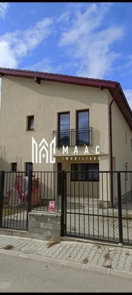 Casa cuplata | Curte proprie | 4 camere | Selimbar - MAAC Imobiliare vă propune spre vânzare casă cuplată situată în zona Șelimbăr, o proprietate modernă, finalizată în anul 2021, ideală pentru o familie care își dorește confort, spațiu generos și acces facil către oraș. Imobilul dispune de o suprafață utilă de 149 mp și este amplasat pe un teren de 265 mp, oferind o curte amenajată și multiple spații exterioare pentru relaxare.

Locuința este eficient compartimentată pe două niveluri, cu zone bine delimitate pentru zi și noapte, asigurând funcționalitate și intimitate.

Compartimentare:
-Parter: living spațios cu loc de luat masa – 27.34 mp, bucătărie open-space – 17.91 mp, birou – 10.36 mp, baie – 3.62 mp, vestibul + hol + casa scării – aproximativ 10 mp, 2 terase generoase de 18.58 mp și 7.19 mp
-Etaj: dormitor matrimonial – 18.55 mp cu dressing și baie proprie, dormitor 2 – 18.15 mp, dormitor 3 – 13.41 mp, baie comună – 7.46 mp, dressing separat – 4.72 mp, baie suplimentară – 5.29 mp, hol – 6.86 mp, terasă suplimentară – 7.86 mp

Casa beneficiază de izolație exterioară cu polistiren de 10 cm, contribuind la eficiență energetică sporită. Geamurile termopan Qfort cu 3 foi de sticlă asigură confort termic și fonic ridicat. Curtea este amenajată și pavată cu pișcoturi, oferind un spațiu exterior practic și ușor de întreținut.

Imobilul se predă la gri, cu instalațiile trase, centrală termică și calorifere montate, oferind posibilitatea personalizării finisajelor interioare conform preferințelor viitorului proprietar.

Pentru mai multe detalii, precizați telefonic că ați văzut anunțul CP2569413.