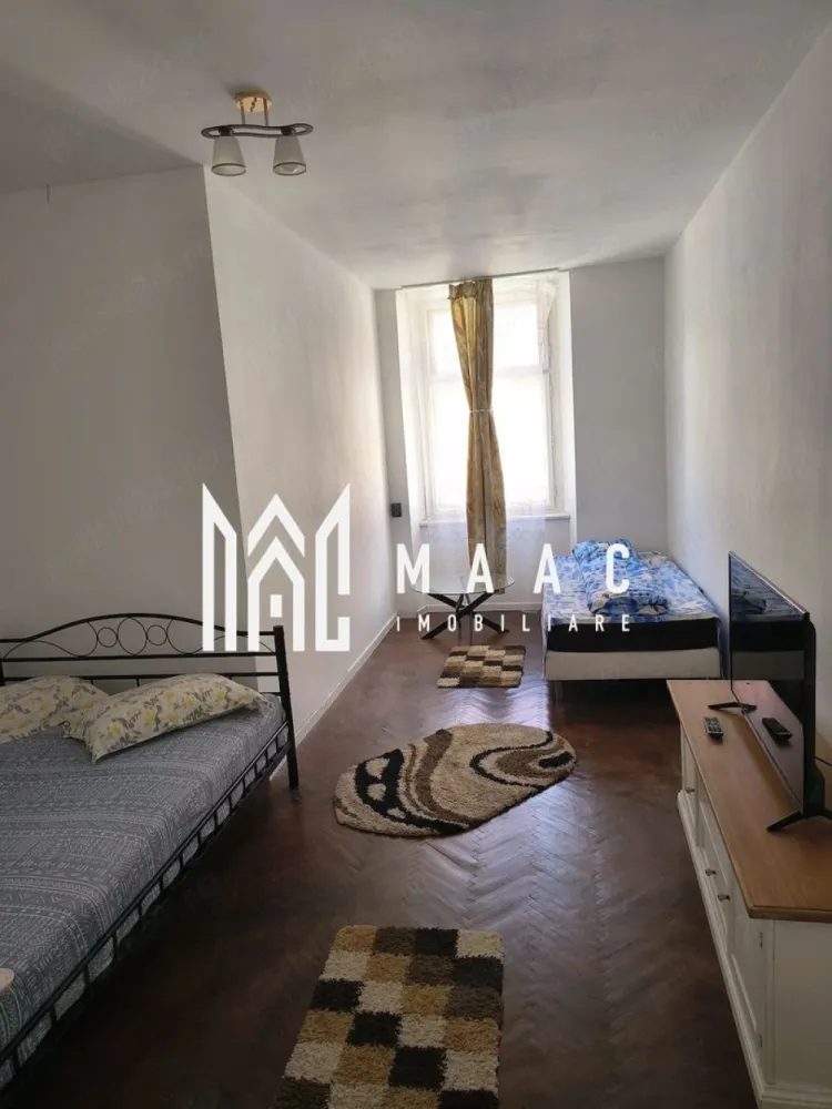 Apartament 3 camere | Etajul 1 | Ultracentrala - MAAC Imobiliare vă propune spre închiriere, pe termen lung, un apartament modern cu 3 camere, situat in zona ultracentrala, aproape de cele mai importante puncte de interes cultural și turistic.

Locuința are o suprafață utilă de 70 mp + boxă pentru depozitare și a fost recent renovată integral, beneficiind de instalații electrice și sanitare complet noi.

Apartamentul se află la etajul 1 al unei case P+1 și se închiriază complet mobilat și utilat, fiind pregătit pentru mutare imediată.

Compartimentare:
-2 dormitoare spațioase
-living open-space cu bucătărie
-baie
-boxă pentru depozitare

Imobilul este amplasat într-o curte comună.

Condiții de închiriere:
-Perioadă minimă: 1 an 
-Garanție: echivalentul unei luni de chirie
-Nu se acceptă animale de companie

Proprietatea este ideală pentru rezidență pe termen lung într-o zonă centrală.

Pentru mai multe detalii, vă rugăm să menționați telefonic că ați văzut anunțul cu CP3072379
