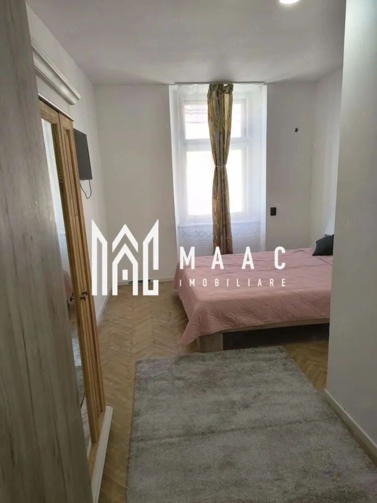 Apartament 3 camere | Etajul 1 | Ultracentrala - MAAC Imobiliare vă propune spre închiriere, pe termen lung, un apartament modern cu 3 camere, situat in zona ultracentrala, aproape de cele mai importante puncte de interes cultural și turistic.

Locuința are o suprafață utilă de 70 mp + boxă pentru depozitare și a fost recent renovată integral, beneficiind de instalații electrice și sanitare complet noi.

Apartamentul se află la etajul 1 al unei case P+1 și se închiriază complet mobilat și utilat, fiind pregătit pentru mutare imediată.

Compartimentare:
-2 dormitoare spațioase
-living open-space cu bucătărie
-baie
-boxă pentru depozitare

Imobilul este amplasat într-o curte comună.

Condiții de închiriere:
-Perioadă minimă: 1 an 
-Garanție: echivalentul unei luni de chirie
-Nu se acceptă animale de companie

Proprietatea este ideală pentru rezidență pe termen lung într-o zonă centrală.

Pentru mai multe detalii, vă rugăm să menționați telefonic că ați văzut anunțul cu CP3072379