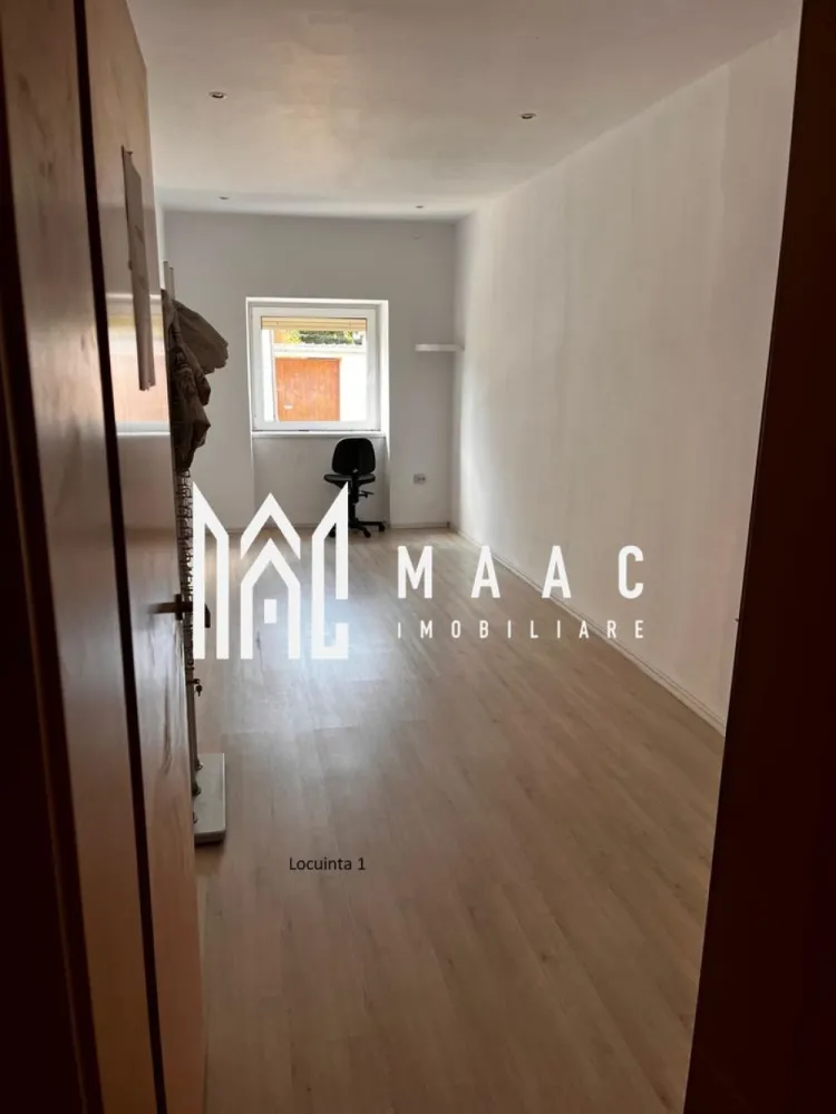 Casa individuala | Teren 510 mp | Cisnadie - MAAC Imobiliare va propune spre vanzare o casa individuala,situata in zona centrala a orasului Cisnadie.

Detalii generale:

Suprafață teren: 510 mp
Suprafata utila: 176 mp
Garaj: 60 mp
Curte: 128 mp
Grădină de 147 mp și fântână proprie.

Aceasta casa este ideală atat pentru locuință cat și pentru afacere (spațiu comercial, after-school, loc de joacă).
Dispune de incalzire in pardoseala, avand centrala proprie.
Acoperisul a fost recent renovat cu țiglă nouă.

Locuința 1:
Configurație: Pivniță + Parter + Mansardă.
Pivniță: 16,86 mp.
Parter: 82,42 mp (Hol, cămară, debara, bucătărie, baie, living – parțial amenajate).
Etaj/Mansardă: 92,76 mp neamenajați (plan existent pentru 3 dormitoare, fiecare cu dressing și o baie).
Utilități: Branșamente separate (gaz, apă, curent).

Locuința 2:
Configurație: Parter.
2 dormitoare: 16,7 mp fiecare.
Living open-space cu bucătărie: 23 mp.
Cămară: 7 mp.
Baie: 8 mp.
Birou: cameră separată.
Verandă.
Spații anexe:
Garaj: 59 mp – clădire separată.
Curte: 128 mp – împărțită cu o altă persoană.
Grădină: 147 mp – ideală pentru relaxare sau amenajări personalizate.

Pentru mai multe detalii sau pentru a programa o vizionare va rugam sepcificati telefonic ID: CP2247889