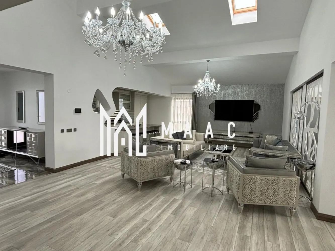 Casa /Vila de Lux | Teren 630 mp | Sibiu - MAAC Imobiliare vă invita să descoperiți o vilă exclusivistă, situată într-o locație privilegiată, la doar cateva minute de centrul orașului, care îmbină eleganța, confortul și funcționalitatea într-un design contemporan. Cu o suprafață utilă de 196,3 mp și un teren generos, această proprietate oferă un stil de viață rafinat, într-un cadru liniștit și accesibil.

Caracteristici principale:

Suprafață utilă: 196,3 mp, distribuiți eficient pe un nivel și un subsol amenajat
Teren generos: 630 mp, ideal pentru grădină, loc de relaxare, sau pentru organizarea de evenimente în aer liber

Compartimentare excelentă:
La parter: un living spațios și luminos, perfect pentru relaxare sau întâlniri sociale, și o zonă de dining elegantă, care se deschide către o bucătărie complet echipată
 3 dormitoare care beneficiază de baie proprie si dressing.
 două bucătării situate la parter, ideală pentru gătit în familie sau pentru a vă bucura de momente de socializare, iar a treia este amplasată la subsol, perfectă pentru prepararea meselor pentru petreceri sau întâlniri cu prietenii.
Subsol amenajat: Un spațiu versatil pentru evenimente, cu un sistem de iluminat ambiental 
Finisaje de lux: utilizarea celor mai bune materiale și tehnici de construcție, inclusiv parchet , marmură de calitate superioară, feronerie premium, și instalații de iluminat moderne.
Fiecare cameră este luminată natural, datorită geamurilor mari și a designului deschis, creând un ambient plăcut și primitor.

Curte proprie: cu suficiente spații verzi pentru a crea o grădină privată sau loc de joacă, având totodată opțiunea de a amenaja o piscină sau terasă exterioară.

Avantaje suplimentare:
Locație excelentă: la doar 5 minute de oraș, vă veți bucura de acces rapid la toate facilitățile urbane, păstrând în același timp liniștea și intimitatea unei locuințe exclusiviste, înconjurată de natură.
Locuri de parcare: spațiu generos pentru parcare, inclusiv locuri de parcare pentru vizitatori.

Pentru mai multe informatii specificati ca ati vazut anuntul cu ID: CP2218499