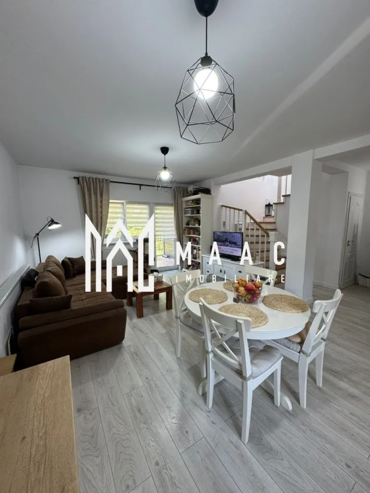 Casa individuala | Teren | Zona Sura Mare - MAAC Imobiliare vă propune spre vânzare o casă tip duplex situată într-un cartier rezidențial din Șura Mare, într-o zonă liniștită, potrivită pentru familie, cu acces facil către oraș. Proprietatea beneficiază de un teren total de 265 mp, dintre care 215 mp reprezintă teren liber, oferind spațiu generos pentru curte și amenajări exterioare. Locuința are regim de înălțime P+M și este compartimentată eficient, cu delimitare clară între zona de zi și zona de noapte. Compartimentare: -Parter: bucătărie open space, baie de serviciu complet mobilată și utilată, spațiu de depozitare închis tip dressing, living spațios cu acces direct în curtea interioară -Etaj: două dormitoare matrimoniale spațioase, fiecare cu balcon individual, baie complet mobilată și utilată Ambele băi sunt prevăzute cu geam de aerisire, una fiind dotată cu cabină de duș, iar cealaltă cu cadă. Proprietatea dispune de o grădină spațioasă de 215 mp, carport pentru mașină și spațiu de depozitare extern, oferind funcționalitate și confort pentru locuire permanentă. Pentru mai multe detalii precizați telefonic că ați văzut anunțul cu CP2137299.