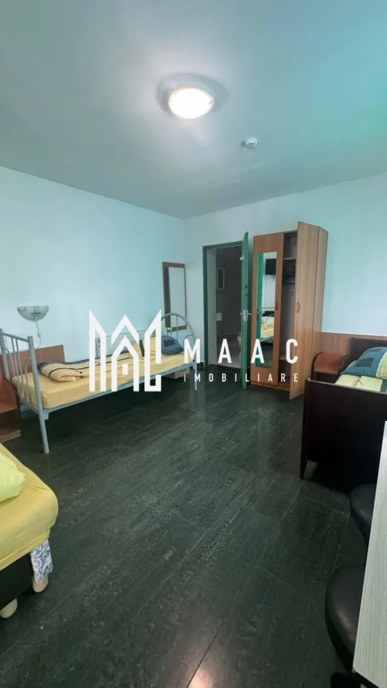Pensiune la cheie | 229mpu/ nivel | 7 minute de centru sibiului - MAAC Imobiliare va oferă spre vanzare o pensiune complet utilata.
Localizare: Sibiu

Caracteristici și Dotări:
Camere: 13 camere, fiecare cu baie proprie

Spații comune:
Bucătărie complet echipată
Recepție/Bar pentru primirea oaspeților
Terasă spațioasă pentru relaxare
Birou/Oficiu: Spațiu dedicat pentru activitățile administrative

Avantaje și Facilități:
Confort: Fiecare cameră este dotată cu toate necesitățile pentru a oferi un sejur plăcut oaspeților
Utilități: Pensiunea este echipată cu toate utilitățile necesare pentru funcționare, inclusiv 2 centrale proprii
Siguranță: Scară de incendiu și autorizație ISU
Design: Interior modern și funcțional, potrivit pentru o experiență turistică de calitate

Oportunitate de Investiție:
Profitabilitate: Ideală pentru investiție în domeniul turismului, având potențial ridicat datorită numărului mare de camere și facilităților oferite
Localizare: Situată într-o zonă atractivă din Sibiu, care atrage turiști pe tot parcursul anului

Pentru mai multe informații sau pentru a programa o vizionare, nu ezitați să ne contactați, specificand ID: CP2083185