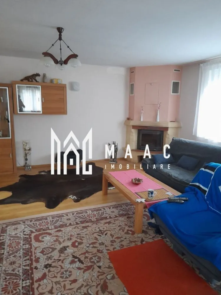 Casa individuala | 7 camere | Alma, Judetul Sibiu - MAAC Imobiliare vă propune spre vanzare o casa cu 7 camere, amplasată în comuna Alma, într-o zonă liniștită și plină de farmec.
Construită în 2013, această proprietate este ideală pentru cei care caută un cămin confortabil, bine compartimentat.

Cu regim de inaltime S+P+M, proprietatea are o pivnita racoroasa si un bar amenajat la subsol; la parter (115mp) gasim un garaj spatios, cu acces in casa, hol, living cu semineu, bucatarie moderna, dormitor si 2 bai (una mare, cu dus si cada, alta de serviciu); mansarda (90 mp)-3 dormitoare, hol, baie cu dus, balcon, acces la pod, terasa acoperita.

In curte-anexă care include: bucătărie de vară, atelier, copertină pentru lemne.

Dotari: curent trifazic, centrală termică pe gaz, semineu, panou solar pentru apă caldă menajeră, geamuri termopan cu rulouri, apă curentă și canalizare, conectate la rețeaua locală.
Grădina generoasă, de 800 m², e amenajată cu pomi fructiferi și viță de vie.
Fântână.

Fie că te bucuri de grădina generoasă, de spațiile interioare bine gândite sau de liniștea zonei, acest loc te va face să te simți "acasă" încă de la prima vizită.

Proprietatea se vinde complet mobilată.

Pentru mai multe informații și pentru a programa o vizionare, ne poți contacta chiar acum! Nu uita să specifici ID-ul anunțului: CP2066511