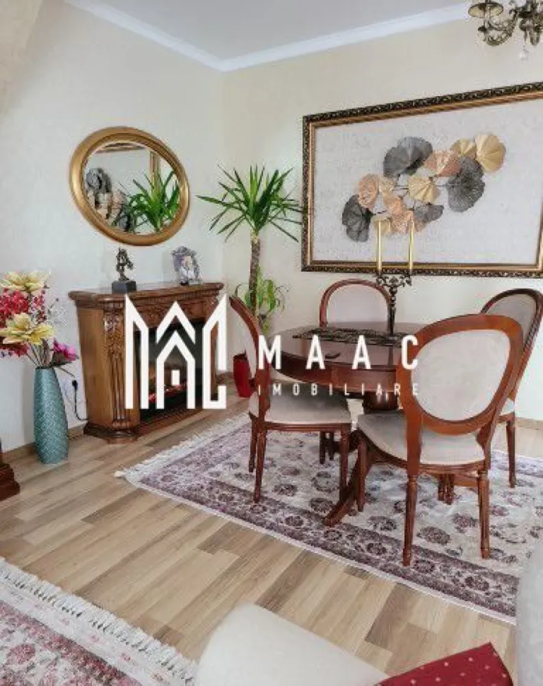 Casa tip Duplex | P+M | 4 camere | 148 MP | Curte | Cisnadie - MAAC Imobiliare va prezinta o casa tip Duplex cu suprafata utila de 148 mp situata in Cisnadie.

Complet mobilată și utilată, situată într-o zonă liniștită în Cisnădie, această proprietate spațioasă, construită în anul 2012, este destinată rezidenței și oferă toate facilitățile necesare pentru un stil de viață modern și confortabil.

Caracteristici:
Suprafață utilă: 148 mp perfect pentru o familie care dorește confort și funcționalitate.

Anul construcției: 2012, realizată cu materiale de calitate și tehnici moderne de construcție, asigurând durabilitate și eficiență energetică.

Încălzire centrală proprie: sistem de încălzire eficient, asigurând confort termic pe tot parcursul anului.

Compartimentare și spații utilitare:
Living spațios: 42 mp ideal pentru momentele de relaxare
Dotat cu șemineu, creând o atmosferă caldă și primitoare.

Dormitoare:
3 dormitoare luminoase, oferind intimitate și confort pentru fiecare membru al familiei.

Băi: 2 băi dotate cu toate facilitățile necesare.

Bucătărie: Complet mobilată și utilată.

Spații utilitare:
Boxă la subsol, debara și WC de serviciu.

Dotări și Finisaje: Casa se vinde complet mobilată.

Scară interioară:
Design modern și funcțional, conectând armonios spațiile de locuit.

Telecomandă poarta acces auto și garaj:
Acces auto facil și securizat, asigurând confortul și siguranța mașinii dumneavoastră.

Amenajare și Facilități Exterioare:
Curte: 100 mp, pavata și amenajată cu plante și arbusti decorativi.

Străzi:
Asfaltate și iluminate stradal, asigurând acces facil și sigur la proprietate.

Pentru mai multe detalii precizati telefonic ca ati vazut anuntul cu ID: CP2043669