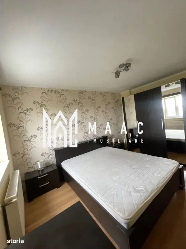 Apartament 4 camere | 100 MPU | Balcon | Decomandat | Strand - MAAC Imobiliare va prezinta un apartament cu 4 camere, balcon, 100mp in zona Ștrand.

Detalii principale:
Suprafață utilă: 100mp
Structură: Apartament pe două nivele (etaj + mansardă)
Orientare: Sud-vest, cu priveliște splendidă spre munți
An construcție: 2012
Etaj: 6

Compartimentare:
Primul nivel (60mp):
Hol primitor.
Baie complet utilată: Modernă și funcțională, cu toate facilitățile necesare.
Living generos open-space cu bucătăria.
Două dormitoare: Luminoase și spațioase.
Balcon închis.

Al doilea nivel (mansardă, 40mp):
Dormitor: Dotat cu un șemineu electric, creând o atmosferă caldă și primitoare.
Baie complet utilată.

Facilități și avantaje:
Proximitate: La doar 10 minute de zona centrală a Sibiului.
Acces facil: Aproape de mijloacele de transport în comun, supermarket-uri și farmacie.

Pentru mai multe detalii precizați telefonic că ati văzut anunțul cu ID: CP2027584