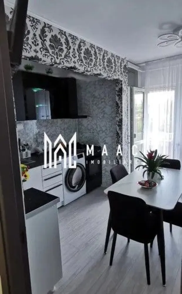 Apartament 3 camere | 2 Balcoane | 51 MPU | Cisnadie - MAAC Imobiliare vă prezintă un apartament spațios cu 3 camere decomandate, situat la etajul 2 din 4, în Cisnădie, într-o zonă liniștită și apreciată, aproape de Penny și complexul Zacharia, cu acces rapid către Sibiu.

Compartimentare:
Living spațios
2 dormitoare
Bucătărie separată
Baie
Hol 
2 balcoane, dintre care unul închis.

Dotări și beneficii:
Apartament decomandat
Centrală termică proprie
Geamuri termopan
Bloc izolat termic
Loc de parcare în fața blocului
Se vinde complet mobilat și utilat, exact ca în poze
Tot mobilierul și electrocasnicele sunt noi și beneficiază de garanție.

Avantaje locație:
Zonă liniștită și bine conectată
Aproape de magazine, farmacii, școli și mijloace de transport

Pentru mai multe informații, specificați ca ați văzut anunțul cu ID: CP3078797