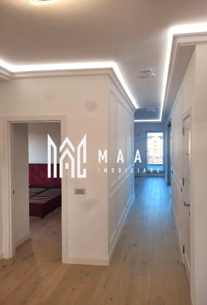 Penthouse de lux I 4 camere I Zona Sub Arini - MAAC Imobiliare vă propune spre vânzare un penthouse de lux, situat într-un complex rezidențial modern, conceput pentru un stil de viață exclusivist, cu suprafețe generoase și facilități premium. Proprietatea se remarcă prin spațiul amplu, luminozitatea naturală și terasa impresionantă, oferind confort la standarde înalte.

Apartamentul tip penthouse are o suprafață de 135 mp și este compartimentat eficient pentru a asigura funcționalitate și intimitate:
-3 dormitoare
-2 băi
-bucătărie open-space
-living cu ieșire pe terasă

Zona de zi este gândită ca un spațiu deschis și generos, beneficiind de lumină naturală abundentă, ideal pentru amenajarea unui cămin modern și elegant. Compartimentarea inteligentă permite delimitarea clară a zonei de relaxare de cea de noapte, menținând în același timp un ambient aerisit și primitor.

Terasa amplă de 150 mp reprezintă un element distinctiv al proprietății, oferind posibilitatea amenajării unei grădini urbane sau a unui spațiu de relaxare privat. Poziționarea la etaj superior asigură o priveliște deosebită și un plus de intimitate.

Proprietatea dispune de:
-boxă
-loc de parcare subteran
-lift cu acces direct din apartament până la subsol

În cadrul complexului există hotel cu centru SPA, completând astfel experiența rezidențială prin facilități dedicate relaxării și confortului.

Pentru mai multe detalii, vă rugăm să menționați numărul CP1966325 la telefon.