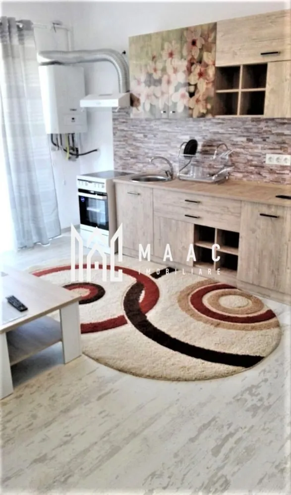 Apartament 2 camere | Balcon | Lift | Doamna Stanca - MAAC Imobiliare vă propune spre închiriere un apartament cochet și modern, situat într-o zonă liniștită, în apropierea marilor centre comerciale. Proprietatea este ideală pentru persoane singure sau cupluri care își doresc confort, accesibilitate și un spațiu bine organizat.

Apartamentul este amplasat la parterul unui imobil cu 6 etaje și beneficiază de o compartimentare practică și funcțională.

Compartimentare:
living luminos cu bucătărie open space
dormitor primitor
baie
hol

Dotări și avantaje:
apartament modern și bine întreținut
bucătărie open space complet funcțională
loc de parcare privat inclus
imobil dotat cu 2 lifturi
zonă liniștită și accesibilă
compartimentare eficientă pentru confort sporit

Localizare:
situat într-o zonă cu acces rapid către marile centre comerciale, magazine, farmacii, restaurante și mijloace de transport.

Condiții de închiriere:
disponibil imediat
se percepe garanție echivalentul unei chirii lunare
se caută chiriași serioși pentru contract pe termen lung

Pentru mai multe detalii sau pentru programarea unei vizionări, vă rugăm să ne contactați specificand ID: CP3082459