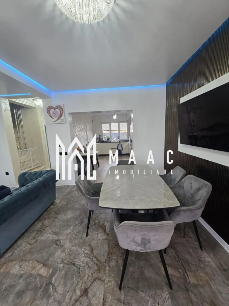 Casa 4 camere | Curte si terasa | Selimbar - MAAC Imobiliare vă propune spre vânzare o casă tip duplex modernă și elegantă, situată într-o zonă rezidențială din Șelimbăr, ideală pentru cei care își doresc confort, intimitate și un stil de viață modern. Proprietatea se remarcă prin compartimentarea eficientă, finisajele premium și ambientul rafinat, fiind alegerea potrivită pentru o familie care caută o locuință pregătită pentru mutare imediată.

Casa dispune de o suprafață utilă de 111 mp și este compartimentată inteligent pentru a răspunde perfect nevoilor unei familii moderne. Locuința beneficiază de 3 dormitoare spațioase și luminoase, amenajate cu bun gust, oferind un spațiu confortabil și relaxant pentru fiecare membru al familiei.

Zona de zi impresionează prin livingul generos amenajat în concept open space cu bucătăria complet mobilată și utilată, creând un spațiu ideal pentru petrecerea timpului alături de familie și prieteni. Designul modern, mobilierul atent ales și finisajele de calitate superioară contribuie la crearea unei atmosfere elegante și primitoare în întreaga locuință.

Proprietatea dispune de 2 băi complet echipate, amenajate cu materiale și obiecte sanitare premium, accentul fiind pus pe funcționalitate, confort și estetică modernă.

Casa se vinde finisată și mobilată lux, fiind pregătită pentru mutare imediată, fără necesitatea unor investiții suplimentare. Terenul aferent, cu suprafața de 226 mp, oferă spațiul perfect pentru amenajarea unei zone de relaxare, terasă sau loc de joacă.

Caracteristici și avantaje:
-Casă tip duplex
-Suprafață utilă de 111 mp
-Teren de 226 mp
-3 dormitoare spațioase
-Living open space cu bucătărie
-Bucătărie complet mobilată și utilată
-2 băi complet echipate
-Finisaje premium
-Mobilată și utilată lux
-Zonă rezidențială din Șelimbăr
-Pregătită pentru mutare imediată
-Spațiu pentru relaxare, terasă și loc de joacă

Proprietatea reprezintă o alegere excelentă pentru cei care caută o casă de vânzare în Șelimbăr, într-o zonă liniștită și apreciată, cu acces facil către Sibiu și punctele de interes din împrejurimi.

Pentru mai multe detalii și programarea unei vizionări, vă rugăm să contactați echipa MAAC Imobiliare și să menționați CP3088092 la telefon.
