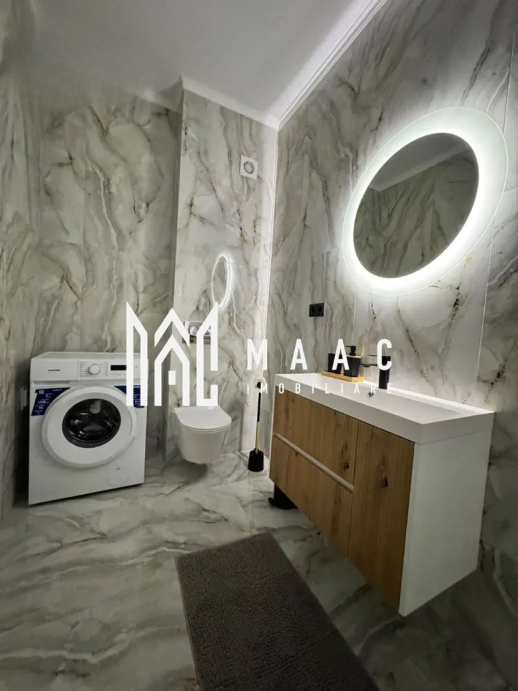 Apartament 2 camere | Terasa 39 MP | Modern | Selimbar - MAAC Imobiliare vă prezintă un apartament ideal atât pentru locuit, cât și pentru investiție în regim hotelier. 

Compartimentare:
Living spațios, amenajat într-un stil minimalist și elegant
Bucătărie cu zonă de dining 
Dormitor matrimonial
Baie modernă
Terasă premium cu jacuzzi privat
Acces separat către terasă prin grădină

Dotări și beneficii:
Încălzire în pardoseală
Finisaje si mobilier atent ales
Compartimentare practică și funcțională
Loc de parcare propriu inclus
Boxă de depozitare inclusă
Ideal pentru locuit sau investiție Airbnb/Booking.

Apartamentul se vinde exact ca în fotografii, complet mobilat și utilat, inclusiv jacuzzi, așternuturi, tacâmuri și toate elementele necesare pentru mutare imediată sau exploatare în regim hotelier.

Pentru mai multe detalii sau pentru programarea unei vizionări, vă rugăm să ne contactați și să menționați ID-ul proprietății: CP3086702