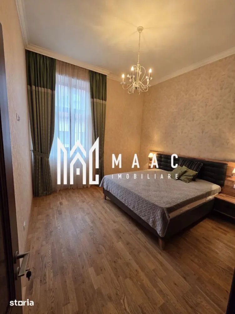 Apartament 2 camere | 55 MPU | Centrul Istoric - MAAC Imobiliare vă propune spre vânzare un apartament cu 2 camere situat în Centrul Istoric al Sibiului, în zona Orașul de Jos, una dintre cele mai apreciate și autentice zone ale orașului. Proprietatea beneficiază de o locație excelentă, ideală pentru persoanele care își doresc confort, eleganță și acces rapid către principalele puncte de interes din Sibiu.

Apartamentul a fost complet renovat în anul 2025 și mobilat premium, fiind pregătit pentru un stil de viață modern și confortabil. Înălțimea camerelor de aproximativ 3,80 m oferă un plus de spațiu, luminozitate și eleganță, iar materialele și dotările atent alese creează un ambient exclusivist și primitor.

Locuința are o suprafață utilă de 55 mp și beneficiază de o compartimentare practică și funcțională:
-living
-dormitor
-bucătărie complet mobilată și utilată
-baie
-hol
-pivniță inclusă

Printre dotările și avantajele proprietății se regăsesc:
-imobil complet renovat și mobilat premium
-izolație fonică și termică superioară
-încălzire în pardoseală Uponor cu control individual pe fiecare cameră
-centrală termică Viessmann Vitodens cu control WiFi
-aer condiționat Gree cu control WiFi
-dressing generos
-finisaje moderne și materiale premium
-camere înalte de aproximativ 3,80 m

Un avantaj aparte al acestei proprietăți îl reprezintă posibilitatea transformării bucătăriei într-un spațiu open-space cu livingul, prin intermediul unei uși triple din lemn de stejar cu vitralii, pliabilă la perete, oferind flexibilitate și un design interior elegant.

Apartamentul este situat în Centrul Istoric al Sibiului – Orașul de Jos, aproape de numeroase puncte de interes:
-muzee
-teatre
-restaurante și cafenele
-magazine și centre comerciale
-mall
-gară și autogară
-mijloace de transport în comun
-școli și grădinițe
-spații verzi pentru relaxare și plimbări

Datorită poziționării premium, renovării complete și dotărilor moderne, această proprietate reprezintă o alegere ideală atât pentru locuit, cât și pentru investiție în regim hotelier sau închiriere pe termen lung în centrul istoric al Sibiului.

Pentru mai multe detalii sau pentru programarea unei vizionări, vă rugăm să ne contactați și să specificați CP3089613.