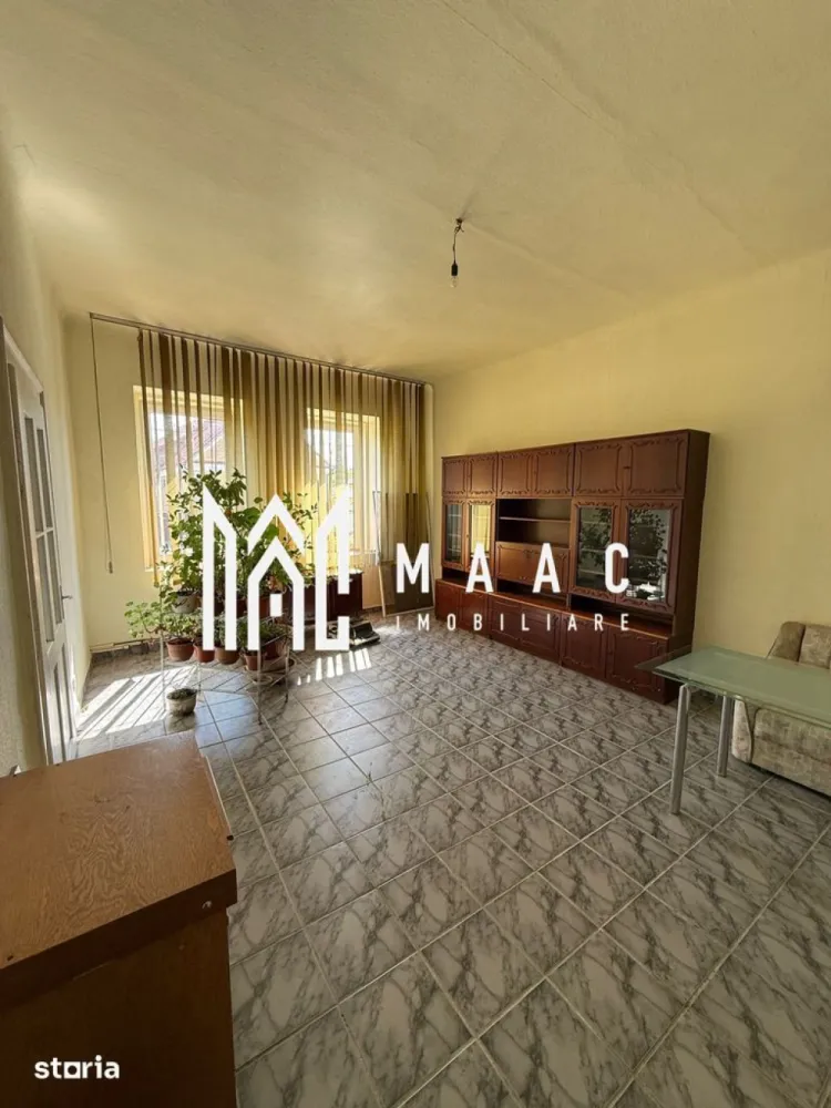 Casa 5 Camere | Teren 1.700 MP | Șura Mică - MAAC Imobiliare vă propune spre vânzare o proprietate generoasă, situată în centrul localității Șura Mică, ideală pentru locuire, activități gospodărești sau investiție.

Caracteristici principale
• teren de aproximativ 1.700 mp
• casă spațioasă de aproximativ 200 mp
• curte generoasă și multiple anexe
• proprietate bine întreținută, cu potențial ridicat

Compartimentare și dotări
• 5 camere luminoase
• 3 băi complet utilate
• ferestre mari, ce oferă lumină naturală din abundență
• pivniță uscată pe toată suprafața casei
• pod uscat și bine întreținut
• se vinde parțial mobilată

Sistem de încălzire și utilități
• centrală pe gaz
• centrală pe lemne
• puffer de 1000 L pentru eficiență sporită
• apă, gaz, curent trifazic
• fântână proprie de aproximativ 10 m

Exterior și anexe
• anexe de aproximativ 50 mp și 70 mp
• șură săsească de aproximativ 150 mp, complet uscată și foarte bine întreținută
• ideală pentru atelier, depozitare sau renovare
• grădină mare în spatele șurii
• seră existentă

Avantaje și potențial
• poziționare centrală în Șura Mică
• proprietate ideală pentru familie numeroasă
• multiple posibilități de utilizare și dezvoltare

Pentru mai multe detalii și programarea unei vizionări, vă rugăm să ne contactați și să specificaț ID:CP3091472