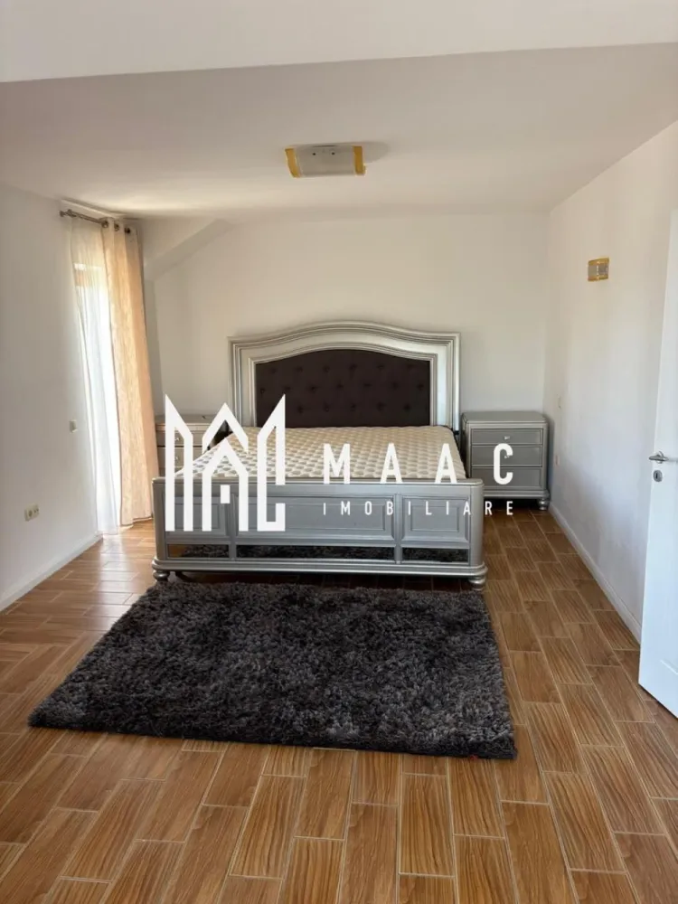 Casă premium în Cisnădioara | 280 mp utili | Teren 1300 mp | 4 dorm - MAAC Imobiliare vă propune spre închiriere o casă spațioasă și elegantă situată în Cisnădioara, într-o zonă liniștită, ideală pentru familii care își doresc confort, intimitate și acces rapid către Sibiu.

Proprietatea dispune de o suprafață utilă de 280 mp și este amplasată pe un teren generos de 1300 mp, oferind spații ample atât la interior, cât și la exterior.

Compartimentarea este eficientă și modernă:

* living open-space cu bucătărie, în suprafață de aproximativ 100 mp;
* 4 dormitoare luminoase;
* 4 băi complet utilate;
* 2 dressinguri;
* pod locuibil sau ideal pentru depozitare;
* pivniță.

La exterior, proprietatea beneficiază de:

* zonă special amenajată pentru barbeque;
* seră pentru legume;
* curte generoasă;
* 4 locuri de parcare, dintre care 2 în garaj.

Casa este dotată cu sistem de alarmă și oferă un nivel ridicat de confort și siguranță.

Proprietatea este ideală pentru cei care caută o locuință premium într-un cadru natural deosebit, aproape de oraș, dar ferit de agitație.
Se percepe garanție în cuantumul unei chirii
Comision agenție 50% din prima chirie!

Pentru mai multe detalii precizați că ați văzut anunțul cu ID: CP3092663