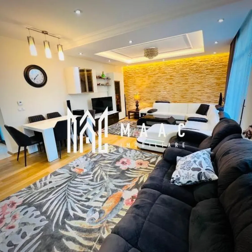 Casă 4 camere | 135mp utili + terasă 55 mp | Curte 180mp - MAAC Imobiliare vă propune spre vânzare o casă modernă și elegantă, situată în Șelimbăr, într-o zonă liniștită, cu acces rapid către Shopping City Sibiu, parcuri și zone de recreere, grădinițe, școli și transport în comun, ideală pentru o familie care își dorește confort și funcționalitate într-un cadru rezidențial bine cotat.

Proprietatea are o suprafață utilă de 134,5 mp, terasă panoramică de 55 mp la etaj retras, teren de 249,5 mp și o curte liberă de aproximativ 180 mp.

Compartimentare:

Parter:
-living generos, cu aer elegant
-bucătărie open-space
-bucătărie închisă, complet utilată
-baie de serviciu
-acces direct către curte

Etaj:
-3 dormitoare spațioase, mobilate modern
-baie mare cu jacuzzi

Etaj retras:
-baie cu duș
-spațiu pentru mașină de spălat rufe
-terasă panoramică de 55 mp

Dotări și finisaje:
-mobilier premium la comandă
-canapele Mobexpert și Divani & Sofa
-tavane cu spoturi și iluminat LED ambiental
-marmură la parter, în hol, bucătării și baie de serviciu
-lemn natural în living
-scară din lemn masiv cu balustradă din fier forjat decorativ
-tâmplărie QFORT tripan
-centrală termică Viessmann
-instalații electrice Schneider

Exterior și facilități:
-curte amenajată cu gazon, plante decorative și gard viu din tuia
-sistem automat de irigații pentru gazon și flori
-poartă de acces și poartă de garaj automatizate cu telecomandă
-două locuri de parcare în curte
-căsuță de grădină pentru depozitare

Locuința se predă complet mobilată și utilată, în stare excelentă, reprezentând o opțiune potrivită pentru cei care caută o casă modernă în Șelimbăr, aproape de facilitățile urbane din Sibiu.

Pentru mai multe detalii sau programarea unei vizionări vă rugăm să menționați la telefon numărul CP2676807.