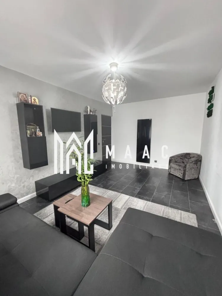 Apartament 2 camere | Nord | Etaj 1 | 44 mpu | - MAAC Imobiliare vă propune spre vânzare un apartament modern și elegant, amenajat într-un stil ultra-modern, cu finisaje premium și atenție deosebită la fiecare detaliu. Proprietatea impresionează prin designul contemporan, paleta cromatică rafinată și compartimentarea practică, fiind ideală pentru un cuplu, o persoană activă sau pentru investiție în vederea închirierii.
Locuința este pregătită pentru mutare imediată și oferă un ambient exclusivist, unde confortul și estetica se îmbină perfect.
Caracteristici:
Apartament modern și complet utilat
Design interior ultra-modern
Finisaje premium
Compartimentare practică și eficientă
Ideal pentru locuit sau investiție
Mutare imediată
Compartimentare:
Living spațios și luminos
Dormitor matrimonial elegant
Bucătărie complet mobilată și utilată
Baie modernă
Hol funcțional cu spații de depozitare
Living:
Canapea generoasă de tip colțar
Perete decorativ cu finisaj special și reflexii sidefate
Mobilier minimalist negru lucios
Corpuri de iluminat cu design geometric futurist
Draperii elegante pentru intimitate și confort
Atmosferă modernă și rafinată
Dormitor:
Pat matrimonial cu tapițerie neagră
Perete decorativ texturat
Dressing integrat
Iluminat ambiental modern
Spațiu confortabil și relaxant
Bucătărie:
Mobilier custom-made negru lucios
Blat cu aspect de marmură neagră
Plită incorporată
Cuptor electric
Hotă
Cuptor cu microunde
Mașină de spălat rufe integrată
Zonă de dining elegantă
Masă albă și scaune din piele ecologică
Baie:
Cadă cu hidromasaj tip jacuzzi
Finisaje ceramice moderne
Calorifer portprosop negru mat
Mobilier funcțional și elegant
Dotări și finisaje:
Aer condiționat modern
Gresie porțelanată în nuanțe închise
Uși interioare moderne cu inserții din aluminiu
Ferestre termopan de calitate superioară
Corpuri de iluminat premium
Elemente decorative moderne
Tablou decorativ cu mușchi stabilizați
Avantaje:
Design exclusivist și modern
Finisaje premium și materiale de calitate
Spații optimizate eficient
Ideal pentru mutare imediată
Perfect pentru investiție și închiriere premium
Confort ridicat și atmosferă elegantă
Pentru mai multe informații și programarea unei vizionări, echipa MAAC Imobiliare vă stă la dispoziție. ID 3109493