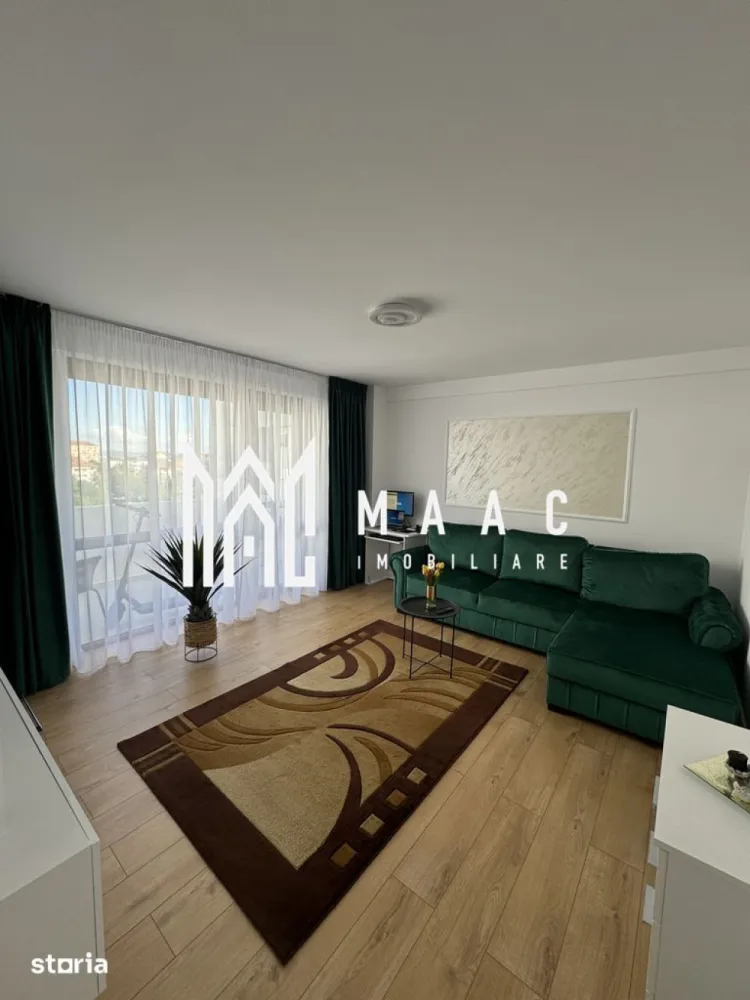Apartament 2 Camere | Decomandat | Terasă 12 MP | Doamna Stanca - MAAC Imobiliare vă propune spre vânzare un apartament modern cu 2 camere decomandate, situat într-un imobil nou cu lift, în zona Doamna Stanca.

Caracteristici principale

• suprafață utilă de 54 mp
• terasă generoasă de 12 mp
• etaj 5 din 7, cu lift
• compartimentare decomandată
• loc de parcare privat inclus în acte

Compartimentare și spații interioare

• living spațios și luminos
• dormitor confortabil
• bucătărie separată cu zonă de dining
• baie modernă
• terasă cu acces atât din living, cât și din bucătărie

Dotări și finisaje

• apartament complet mobilat și utilat
• aer condiționat
• centrală termică prin condensare
• mobilier realizat la comandă
• uși Porta Doors
• colțar extensibil și pat cu spațiu de depozitare
• electrocasnice incluse: mașină de spălat, frigider, plită, cuptor, TV

Localizare și avantaje

• amplasat pe strada Doamna Stanca
• vizavi de Shopping City Sibiu
• acces rapid către supermarketuri, farmacii și clinici medicale
• stații de transport în comun în apropiere
• zonă modernă, foarte bine conectată

 Pentru mai multe detalii sau pentru programarea unei vizionări, vă rugăm să ne contactați și să menționați ID-ul proprietății: CP3116927.