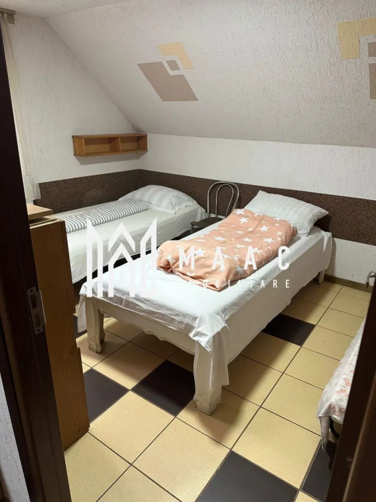 Casa cu 4 apartamente | 9 camere | Curte si Gradina - MAAC Imobiliare ofera spre inchiriere casa cu 4 apartamente cu toate facilitatile, in zona Veterani.

Locuinta are suprafata utila de 250 de mp, desfasurati pe doua nivele. Aceasta este alcatuita din 4 apartamente cu 2 camere spatioase, 4 bai, si inca o camera separata cu baie. Se regaseste bucatarie si baie in fiecare apartament.

Casa are curte si gradina proprie, cu spatiu pentru gratar, sau alte activitati de relaxare.

Se poate parca in curte sau in apropiere, fara probleme. Se pot parca maxim 15 masini in fata casei. Si este si un loc propriu amenajat.

Pretabil pentru firme cu muncitori, dar nu neaparat. Se inchiriaza pe minim un an, se percepe o garantie in cuantumul unei chirii lunare.

Pretul este usor negociabil, in functie de perioada contractuala.

Pentru mai multe detalii precizati telefonic ca ati vazut anuntul cu ID: CP2084922