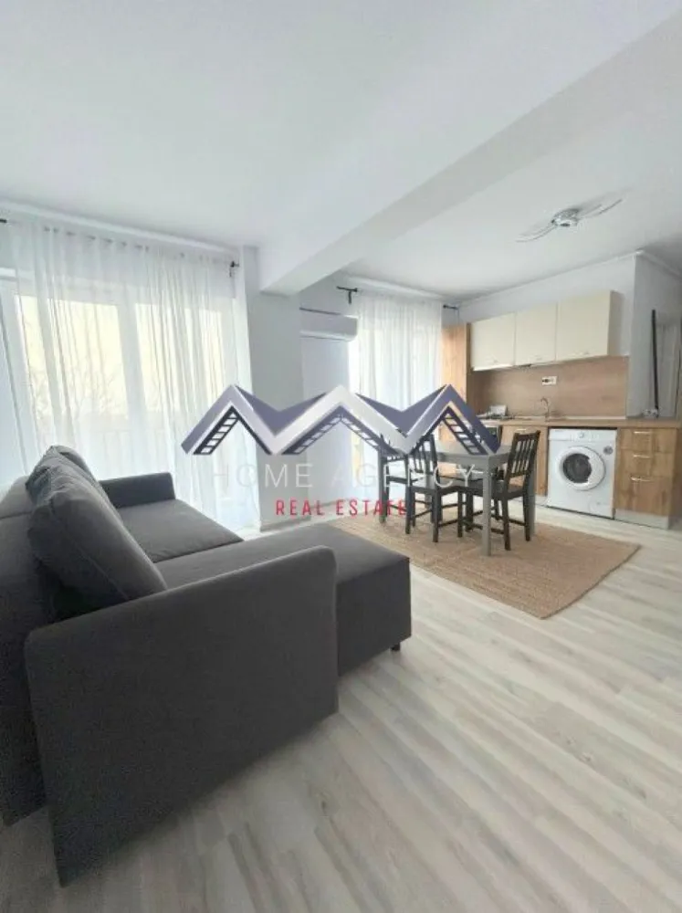 Apartament 2 camere Otopeni - Vă propunem, spre închiriere, un apartament modern și foarte cochet, complet mobilat și utilat, situat la etajul 2/3 într-un bloc nou, poziționat excelent în Otopeni, cu acces rapid către DN1, Centură, Aeroport și toate punctele de interes din zonă.

✨ Detalii apartament:
- Living cu bucătărie open space, luminos, cu acces direct către balcon
- Dormitor confortabil, perfect pentru relaxare
- Baie modernă, dotată cu duș walk-in
- Hol generos, ideal pentru spații de depozitare
- Totul este impecabil, ca nou
- 1 loc de parcare inclus în preț
- Stație de autobuz în fața complexului

Apartamentul este amenajat cu atenție la detalii, oferind un ambient cald, modern și funcțional. Perfect pentru o persoană sau un cuplu care își dorește confort, liniște și o locație excelentă.

📞 Contactează-mă pentru detalii sau pentru a programa o vizionare!