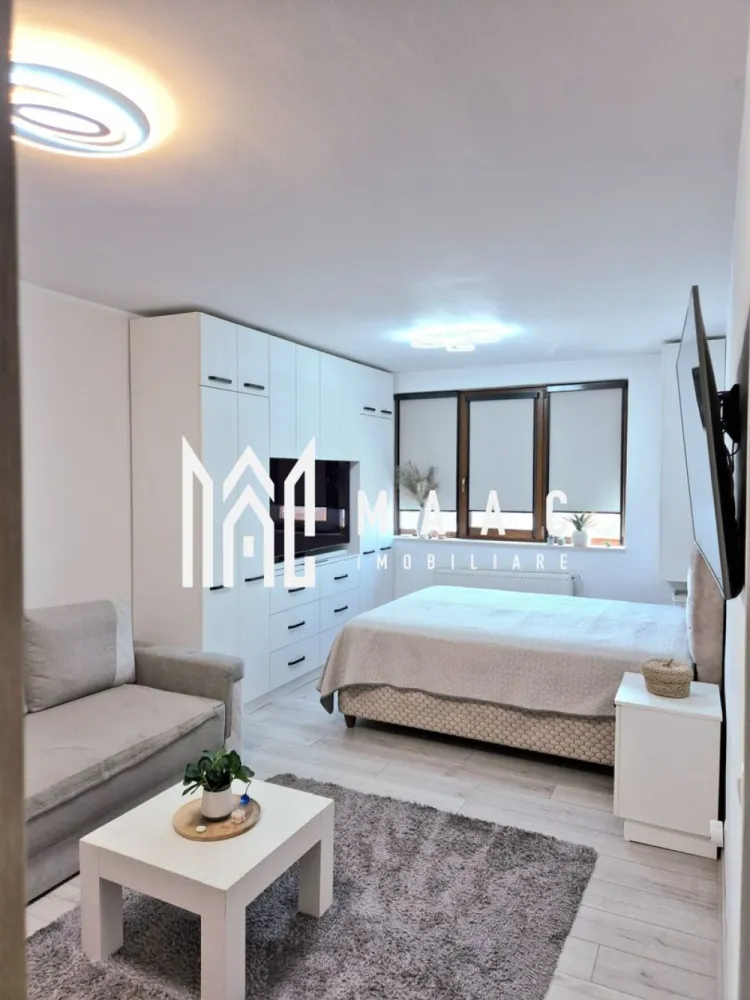 Garsoniera 40 MP | Zona Turnisor Mobilat complet | Balcon 5MP - MAAC Imobiliare vă propune spre vânzare o garsonieră situată în zona Turnișor, cu o suprafață utilă de 40 mp, amplasată la etajul 3 din 4 al unui imobil bine întreținut.

Proprietatea beneficiază de o compartimentare eficientă și dispune de un balcon de 5 mp, oferind un plus de confort și funcționalitate. Garsoniera se vinde complet mobilată și utilată, fiind amenajată cu bun gust și pregătită pentru mutare imediată.

Poziționarea într-o zonă liniștită, în plină dezvoltare, asigură acces facil către puncte de interes precum magazine, mijloace de transport și alte facilități urbane.

Datorită caracteristicilor sale, această proprietate reprezintă o oportunitate atât pentru locuință personală, cât și pentru investiție, având potențial ridicat de închiriere.

Pentru mai multe informații și programarea unei vizionări, vă rugăm să ne contactați.
Vă rugăm specificați CP316393