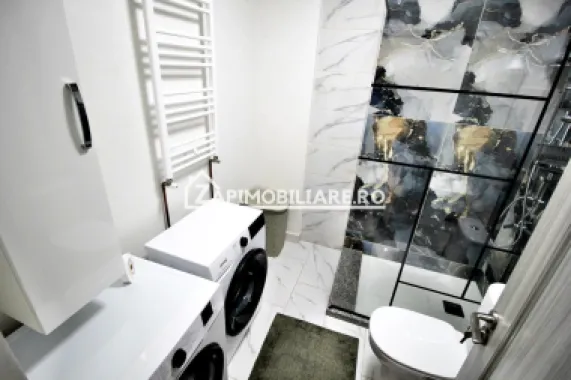 Apartament 1 camera in bloc NOU,46 mp,1 parcare privată