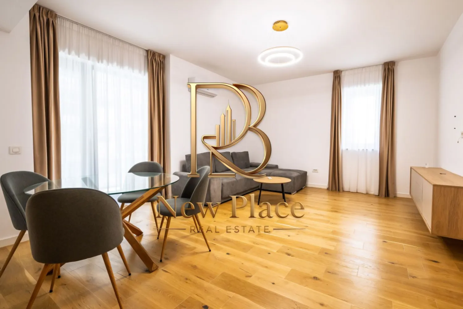 First Estate Pipera | Terase de 19 mp | Etaj intermediar | LUX - New Place Real Estate Company va propune spre inchiriere un apartament situat intr un Ansamblu rezidential dezvoltat in polul de business al Bucurestiului, un ansamblu care redefineste standardele de confort al locuintei, prin calitate si inovatie in constructie, finisaje superioare, compartimentari inteligente si solutii unice de eficientizare energetica.

Apartamentul este situat la Etajul 4/8 si are o suprafata utila totala de 92.70 mp (din care un balcon de 14.70 mp si inca unul de 4.20 mp), suprafata desfasurata astfel: living si dining cu suprafata de 23.00 mp, bucatarie semideschisa cu suprafata de 8.30 mp, dormitor matrimonial cu suprafata de 13.27 mp cu o baie proprie de 4.80 mp, dormitor secundar cu suprafata de 12.60 mp, baie cu suprafata de 3.70 mp si hol cu suprafata de 7.70.

Apartamentul dispune de un loc de parcare care se poate inchiria separat pentru suma de 70 Eur/Luna.

Acest ansamblu rezidential ofera INCALZIRE GRATUITA pentru toate apartamentele din ansamblu! Dispune de un sistem de pompe de caldura geotermala, precum si de un sistem de panouri fotovoltaice. Productia de energie asigurata de aceste sisteme, combinata cu o compartimentare inteligenta a apartamentelor, acopera atat incalzirea eficienta a locuintelor si spatiilor comune, precum si racirea pasiva (prin pardoseala). Costurile de incalzire sunt zero, avand in vedere ca productia de energie verde a ansamblului va avea un excedent anual de peste 50%. Incalzirea se realizeaza prin pardoseala si exista un sistem de monitorizare si control cu termostatare per apartament, cu multizonare in fiecare camera.

In ansamblu se afla doua parcuri verzi, proiectate meticulos pentru repaus si activitate fizica. Acestea ofera spatii pentru destindere, locuri de joaca pentru cei mici si echipamente de fitness pentru exercitii fizice in aer liber.

Finisajele de top completeaza calitatea constructiei, oferind un confort sporit rezidentilor ansamblului:
- Usi de intrare in cladire SCHUCO
- Usi de interior PORTA DOORS
- Lifturi de ultima generatie OTIS
- Usi de intrare in apartament GOLDEN DOOR
- Parchet triplu stratificat BARLINEK
- Tamplarie din PVC VEKA SOFTLINE82
- Gresie & faianta LA PAMESA / MARAZZI
- Obiecte sanitare DALET
- Baterii & accesorii de baie KLUDI
- Compartimentare interioara cu sistem din blocheți de ipsos KNAUF

Pentru mai multe detalii sau oferte similare, nu ezitati sa ne contactati.

Aceasta oferta apartine New Place Real Estate Company.