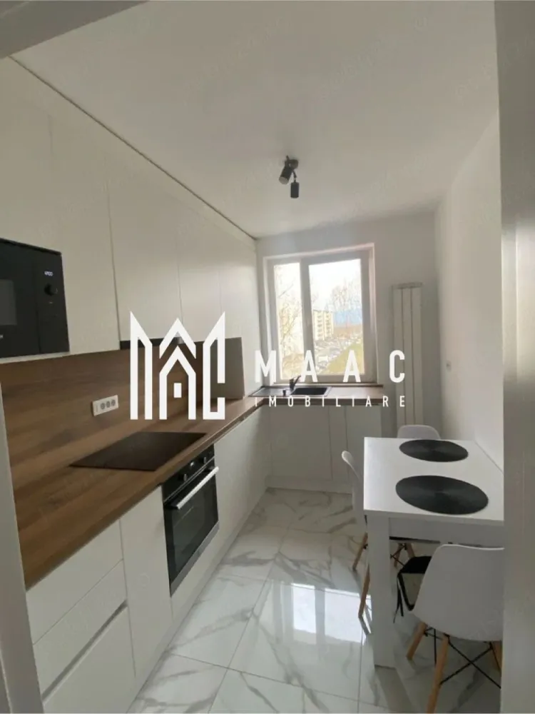 Apartament 2 camere decomandat | Hipodrom 1, Sibiu | 50 mp, balcon, etaj 4 - Apartament cu 2 camere decomandat, 50 mp utili, în Hipodrom 1, Sibiu, disponibil la închiriere cu 430 €/lună. Locuința este situată la etajul 4 și se predă complet mobilată și utilată, cu mutare imediată.

Detalii proprietate:
• Suprafață utilă: 50 mp, suprafață construită: 60 mp
• 2 camere, 1 dormitor, 1 baie, 1 bucătărie
• Compartimentare decomandată, confort 1.
• Etaj 4 din 4, imobil construit în 1991.
• 1 balcon acoperit.
• Finisaje moderne.
• Centrală termică proprie.
• Mașină de spălat rufe, mașină de spălat vase, frigider și cuptor cu microunde
• Două televizoare.
• Complet mobilat și complet utilat.

Zona Hipodrom I oferă acces facil către Lidl, farmacii, supermarketuri, mijloace de transport și alte facilități necesare pentru traiul de zi cu zi.
Pentru detalii suplimentare și programarea unei vizionări, contactați consultantul MAAC Imobiliare. Cod anunț CP3170453.
