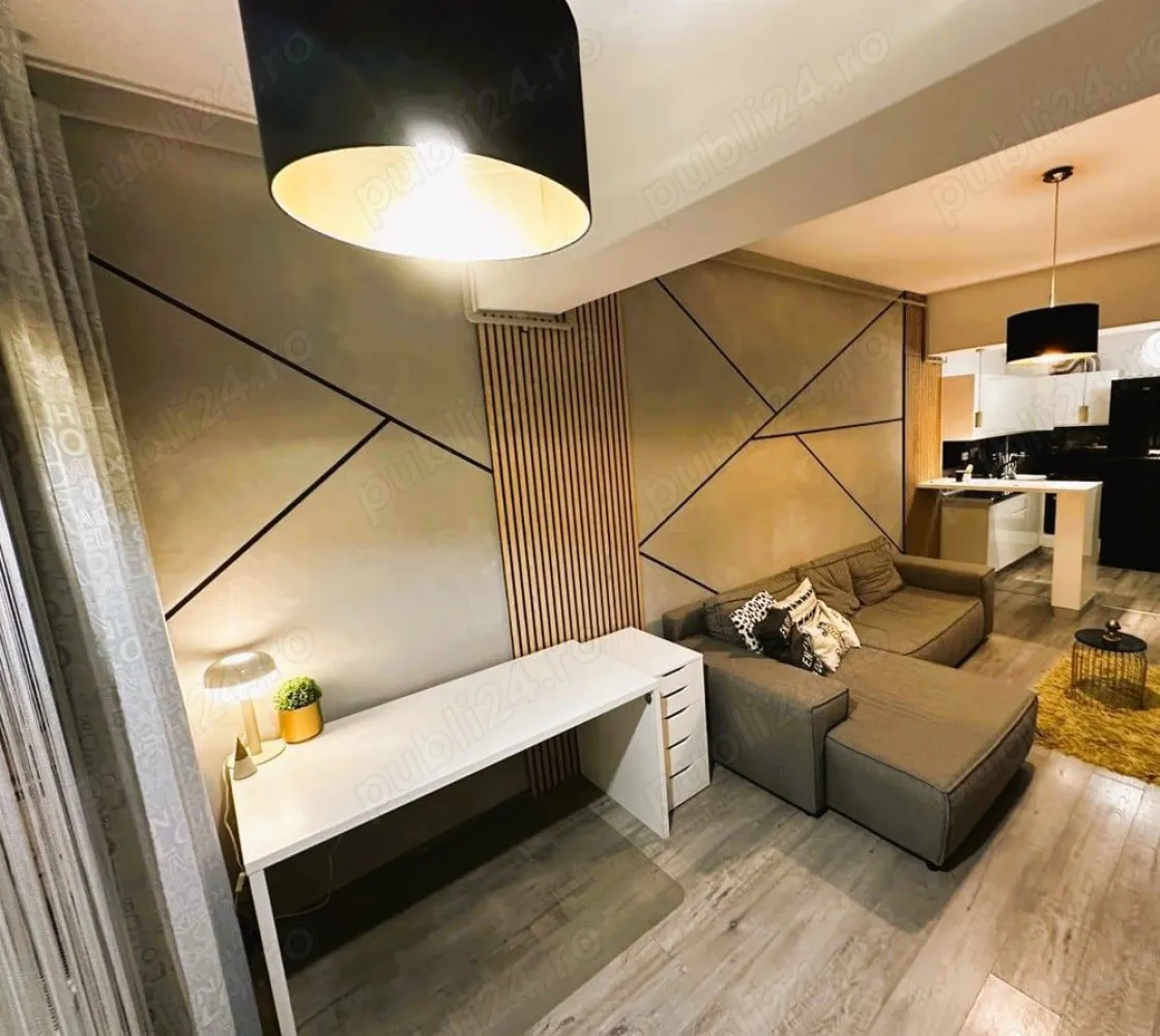 Direct Proprietar inchiriere ap 2 cam rond Alba Iulia unirii Bucuresti - Direct Proprietar inchiriere apartament 2 camere superb Unirii rond Alba Iulia Bucuresti
Direct Proprietar ofer spre inchiriere un superb apartament de 2 camere complet utilat si mobilat modern in zona Bulevardului Unirii Bucuresti, rond Alba Iulia. Apartamentul este situat in spatele Bulevardului Unirii nr 80,(30 metri) intr-un bloc nou securizat cu 2 lifturi, construit in 2018 la etajul 5 din 7. Apartamentul are o suprafata utila de 58 metri patrati si dispune de spatii de depozitare generoase(dressing hol, dressing pe tot peretele in dormitor si un balcon deschis de 5 mp care ofera o priveliste frumoasa libera spre blocurile din Bulevardul Unirii. Apartamentul dispune si de o canapea mare extensibila in living, zona de birou si plasma smart TV cu internet de mare viteza. Apartamentul dispune de centrala proprie si de aer conditionat iar bucataria este de tip open-space cu masa si scaune bar. Mentionez ca pozitia apartamentului este una foarte buna, blocul foarte bine izolat astfel incat facturile de intretinere sunt foarte mici si iarna.
Ca si pozitionare este la cativa pasi de toate restaurantele din zona rond piata Alba Iulia si Bulevardul Unirii sau Decebal (Restaurant Amoon Unirii, Arogant Resturant&Lounge etc) si supermarketuri precum Mega image, Penny la cativa metri de mers pe jos.
De asemenea se poate iesi foarte usor si in Calea Dudesti ajungand imediat in parcarea din spatele Bucuresti MALL (Mall Vitan) astfel incat se poate ajunge la mall in 3 minute de mers pe jos.
Statiile de autobuz sau tramvai sunt la 1 minut distanta iar statia de metrou se afla la 10 minute de mers pe jos sau pana la Piata Unirii se poate ajunge intr-o frumoasa plimbare la pas de 20 minute (cu masina 5 minute).
Pentru mai multe detalii si informatii .Va asteptam cu drag la vizionare!