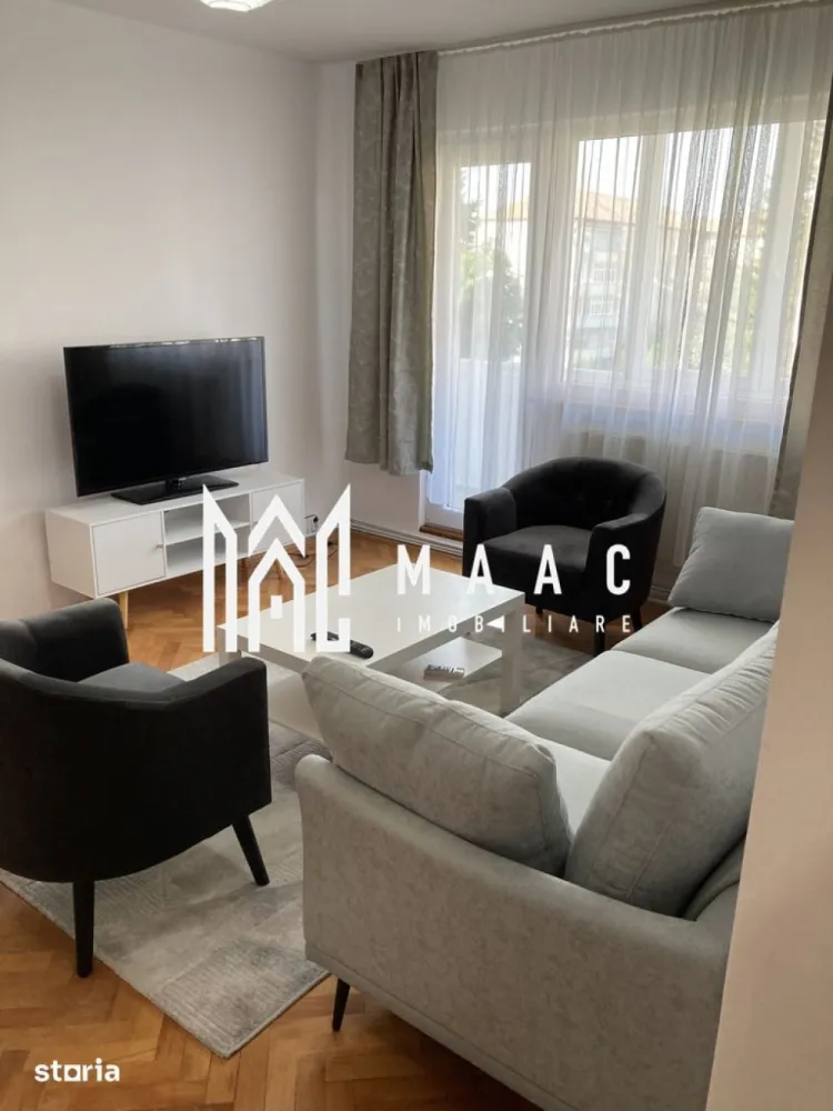 Apartament 2 camere | Etaj 3 | Balcon | Zona Rahovei - MAAC Imobiliare vă propune spre închiriere un apartament modern cu 2 camere, situat în cartierul Hipodrom I, zona Rahovei, una dintre cele mai căutate zone rezidențiale din Sibiu, datorită accesului facil către centre comerciale, școli, mijloace de transport și centrul orașului.

Detalii proprietate
Suprafață utilă: 47 mpu
Balcon: 7 mp
Etaj: 3 din 4
Compartimentare: semidecomandată
Disponibil imediat
Compartimentare
Living luminos
Dormitor
Bucătărie închisă
Baie cu cadă și geam de aerisire
Debara pentru depozitare
Balcon generos
Dotări și beneficii
Complet mobilat și utilat
Aer condiționat
Mașină de spălat rufe
Bucătărie mobilată și echipată
Baie cu ventilație naturală
Debara spațioasă
Apartament renovat recent
Prima închiriere după renovare
Avantaje locație

Aproape de magazine, supermarketuri și farmacii
Stații de autobuz în imediata apropiere
Acces rapid către școli și grădinițe
Conexiune facilă către centrul orașului
Zonă liniștită și bine dezvoltată
Condiții de închiriere
Contract minim 12 luni
Garanție: echivalentul unei chirii lunare
Nu se acceptă animale de companie
Posibilitate de prelungire a contractului

Pentru detalii și vizionare, contactați-ne și menționați codul CP3181544