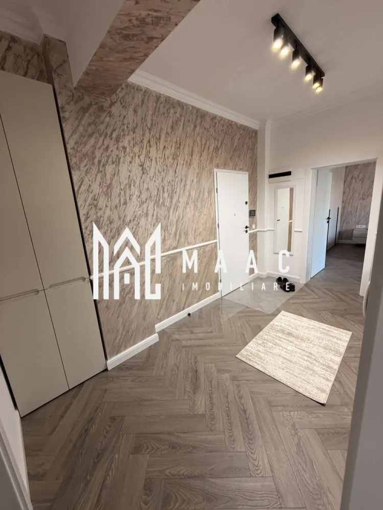 Apartament 3 camere decomandat | Hipodrom 4, Sibiu | 75 mp, lift, 2024 - Apartament cu 3 camere decomandat, situat în zona Hipodrom 4 - Cireșica din Sibiu, cu 75 mp utili, într-un imobil finalizat în 2024, dotat cu lift și pregătit pentru închiriere.

Detalii proprietate:
• Suprafață utilă: 75 mp
• Compartimentare: living, 2 dormitoare, bucătărie, baie și hol
• Etaj 1 din 5
• Imobil finalizat în 2024, construcție din cărămidă
• Complet mobilat și utilat
• Lift în imobil
• 2 locuri de parcare supraterane incluse

Zona oferă acces la școli, grădinițe, transport public, magazine, supermarketuri și conexiune rapidă către centrul orașului, ceea ce face proprietatea practică pentru locuire de zi cu zi.

Pentru detalii suplimentare și programarea unei vizionări, contactați echipa MAAC Imobiliare și menționați Cod anunț CP3189071.