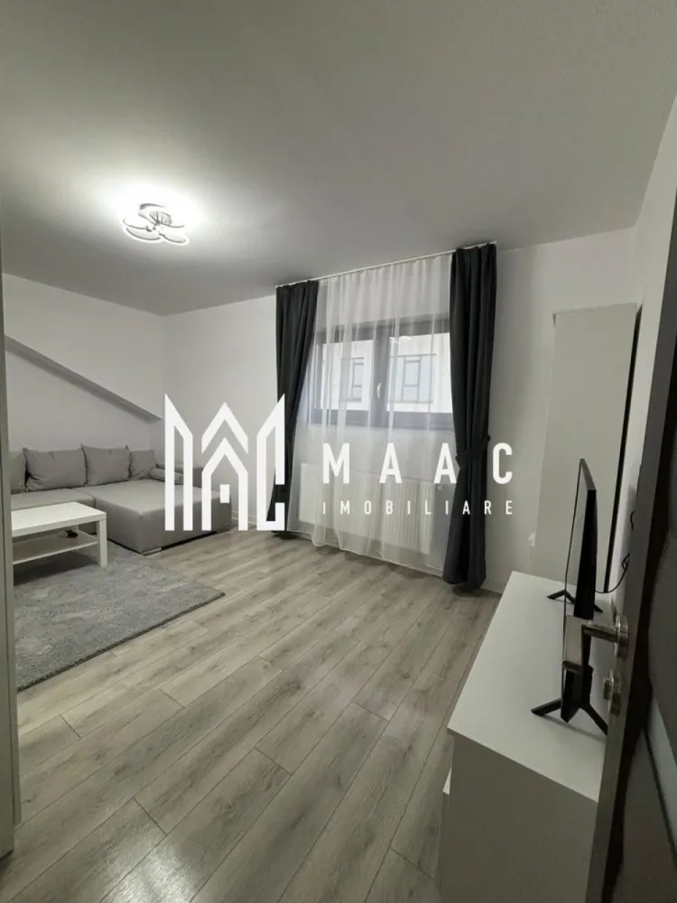 Aparatament 2 camere | Zona Doamna Stanca | 52 mp| - MAAC Imobiliare vă propune spre vânzare un apartament cu 2 camere, situat într-una dintre cele mai căutate zone din Sibiu – Doamna Stanca. Proprietatea este amplasată la un etajul 3 bloc cu acoperis, oferind un echilibru ideal între confort și eficiență termică.

Locuința dispune de o compartimentare practică și luminoasă, fiind compusă din living spațios cu bucătărie inchisa dormitor matrimonial, baie modernă și balcon. Apartamentul se vinde complet mobilat și utilat, cu un design contemporan, atent ales pentru a oferi un ambient plăcut și funcțional.

Finisajele sunt de calitate superioară, incluzând pardoseli moderne, tâmplărie PVC cu geam termopan și obiecte sanitare premium. Totodată, proprietatea beneficiază de un loc de parcare inclus în preț, un avantaj important în zonă.

Zona Doamna Stanca este apreciată pentru accesul facil către centre comerciale, mijloace de transport și alte puncte de interes, fiind ideală atât pentru locuit, cât și pentru investiție.

Pentru mai multe detalii sau programarea unei vizionări, vă stăm cu drag la dispoziție! Specificati CP3191185