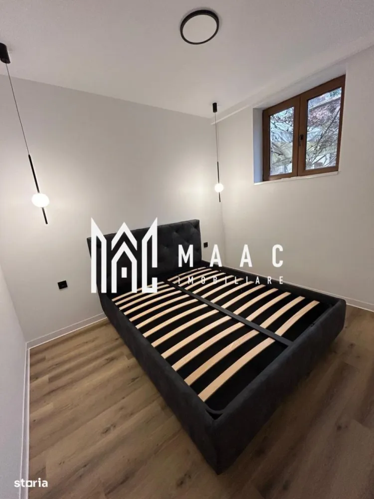 Apartament 2 camere | 50 MPU | Investitie | Ultracentral - MAAC Imobiliare vă propune spre vânzare un apartament exclusivist, situat în zona ultracentrală a Sibiu.
Locuința are o suprafață utilă de 50 mp și beneficiază de acces la o curte comună în suprafață totală de 277 mp, din care cota parte aferentă proprietății este de 109 mp. În plus, apartamentul dispune de pod în suprafață de 45 mp, existând posibilitatea de mansardare în baza unui proiect, ceea ce oferă un potențial real de extindere și valorificare.

Proprietatea este elegant compartimentată astfel:

Hol de acces

Două dormitoare

Living cu bucătărie open-space

Baie

Apartamentul a fost complet reconfigurat și renovat, atât la interior, cât și la exterior (finisaje moderne cu riflaj PVC), fiind predat mobilat și utilat, pregătit pentru mutare imediată sau exploatare în scop investițional.

Poziționarea ultracentrală, la doar câțiva pași de Podul Minciunilor, restaurante, obiective turistice, instituții publice, școli și zone comerciale, face ca această proprietate să fie ideală pentru:

Regim hotelier

Închiriere premium

Birou boutique

Pentru mai multe detalii și programarea unei vizionări, vă rugăm să ne contactați menționând ID: CP2922308