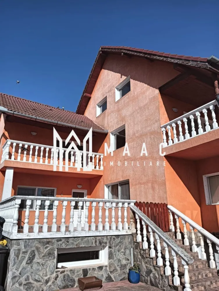 Casa 8 camere I 336 MPU I 1309 MP Teren I Agnita - MAAC Imobiliare va propune spre vanzare o casa amplasată într-o zonă excelentă, ideală pentru locuire sau investiție. Proprietatea oferă un spațiu generos și funcțional, fiind structurată pe demisol, parter și etaj, cu două intrări separate atât în casă, cât și în curte. Suprafața utilă este de 450 mp, iar terenul total măsoară 1309 mp.

Demisolul este compartimentat practic, având două camere, un hol de acces, pivniță și spălătorie — perfect pentru spații tehnice, depozitare sau zone hobby.

Parterul impresionează prin spațiul deschis și luminos, fiind compus dintr-un living cu bucătărie spațioasă, loc de luat masa, o cameră suplimentară, baie, cămară, hol de acces și o terasă ce oferă un loc ideal pentru relaxare. Casa scărilor include un dressing generos, maximizând eficient spațiul.

Etajul cuprinde patru camere, fiecare prevăzută cu balcon propriu, o baie și un hol bine configurat. Spațiul este ideal pentru o familie numeroasă, oferind confort și intimitate.

Proprietatea se remarcă prin terenul întins și posibilitățile multiple de amenajare, iar poziționarea în zonă foarte bună îi conferă un avantaj major pentru cei care caută liniște, siguranță și acces facil la punctele de interes.

Pentru mai multe detalii si programarea unei vizionari va rugam sa specificati ID: CP2852093