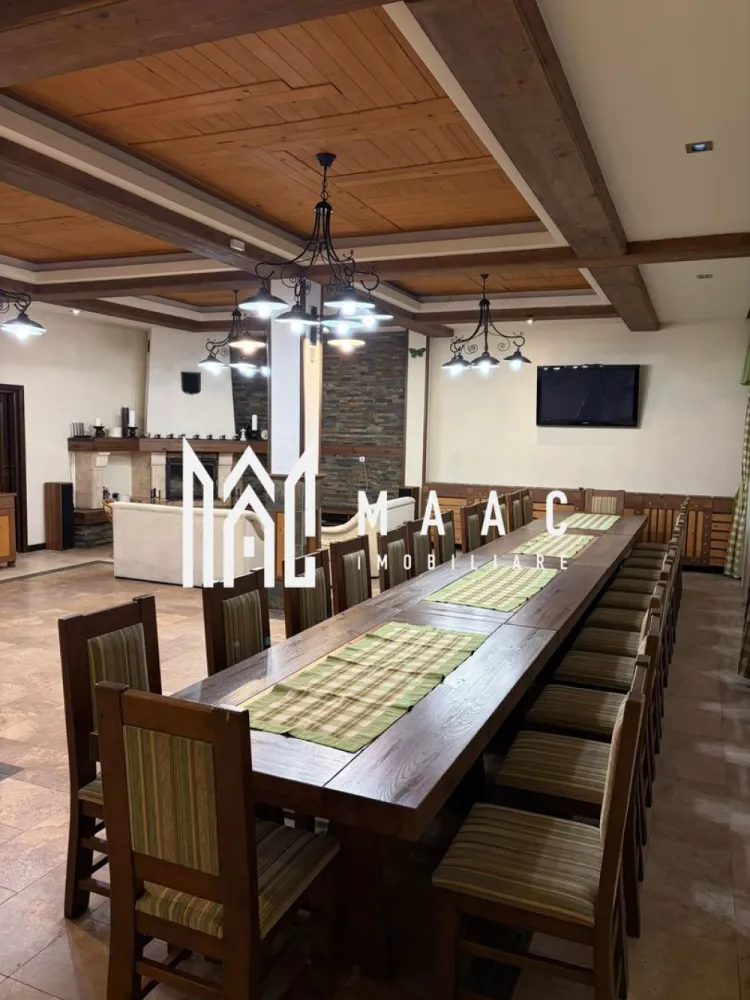 Complex Turistic I Teren 2.100 mp | 600 mp utili I Valea Lotrioarei Sibiu - MAAC va propune spre vanzare Pensiune in Valea Lotrioarei, jud. Sibiu. Proprietate turistică cu potențial ridicat | Investiție + exploatare imediată.
Situată într-un cadru natural spectaculos, pe Valea Lotrioarei, județul Sibiu, Pensiunea oferă liniște, intimitate și acces direct la râu, fiind ideală atât pentru activitate turistică, cât și pentru organizarea de evenimente private sau corporate.
 Descriere proprietate- Pensiunea principală dispune de 12 camere, astfel: 10 camere duble cu bai, 2 apartamente, living generos, zonă de agrement cu șemineu, sală de conferințe, zonă SPA – jacuzzi și saună, bucătărie profesională cu doua compartimente. Încălzire centralizată, cu centrală proprie.
Pe același teren se mai află două vile independente: 
- Vila 1 – 5 camere,hol si baie. 
- Vila 2 – 5 camere,hol si baie. 
Facilități exterioare: filigorie cu vedere directă la râu, zonă de relaxare amenajată la râu, în proprietate, parcare auto, magazie pentru lemne.
Până la finalizarea vânzării, Pensiunea se închiriază exclusiv integral, în regim închis, fiind disponibilă pentru evenimente private, corporate, team-building-uri sau reuniuni de familie.
Pensiunea se vinde ca afacere la cheie, complet funcțională și operațională, fără a necesita investiții suplimentare. Proprietatea este pregătită pentru exploatare imediată, având istoric de funcționare și potențial demonstrat de profitabilitate, fiind ideală pentru investitori care caută un business stabil în turism.
Pentru mai multe detalii si programarea unei vizionari va rugam sa specificati ID: CP2861391.