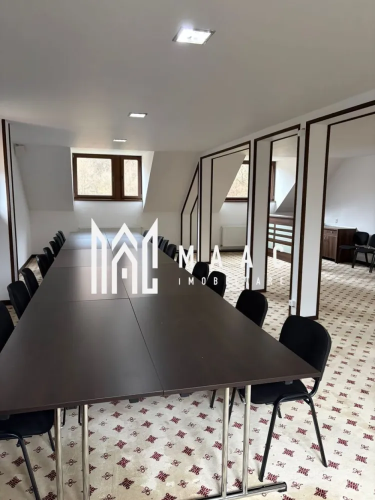 Complex Turistic I Teren 2.100 mp | 600 mp utili I Valea Lotrioarei Sibiu - MAAC va propune spre vanzare Pensiune in Valea Lotrioarei, jud. Sibiu. Proprietate turistică cu potențial ridicat | Investiție + exploatare imediată.
Situată într-un cadru natural spectaculos, pe Valea Lotrioarei, județul Sibiu, Pensiunea oferă liniște, intimitate și acces direct la râu, fiind ideală atât pentru activitate turistică, cât și pentru organizarea de evenimente private sau corporate.
 Descriere proprietate- Pensiunea principală dispune de 12 camere, astfel: 10 camere duble cu bai, 2 apartamente, living generos, zonă de agrement cu șemineu, sală de conferințe, zonă SPA – jacuzzi și saună, bucătărie profesională cu doua compartimente. Încălzire centralizată, cu centrală proprie.
Pe același teren se mai află două vile independente: 
- Vila 1 – 5 camere,hol si baie. 
- Vila 2 – 5 camere,hol si baie. 
Facilități exterioare: filigorie cu vedere directă la râu, zonă de relaxare amenajată la râu, în proprietate, parcare auto, magazie pentru lemne.
Până la finalizarea vânzării, Pensiunea se închiriază exclusiv integral, în regim închis, fiind disponibilă pentru evenimente private, corporate, team-building-uri sau reuniuni de familie.
Pensiunea se vinde ca afacere la cheie, complet funcțională și operațională, fără a necesita investiții suplimentare. Proprietatea este pregătită pentru exploatare imediată, având istoric de funcționare și potențial demonstrat de profitabilitate, fiind ideală pentru investitori care caută un business stabil în turism.
Pentru mai multe detalii si programarea unei vizionari va rugam sa specificati ID: CP2861391.