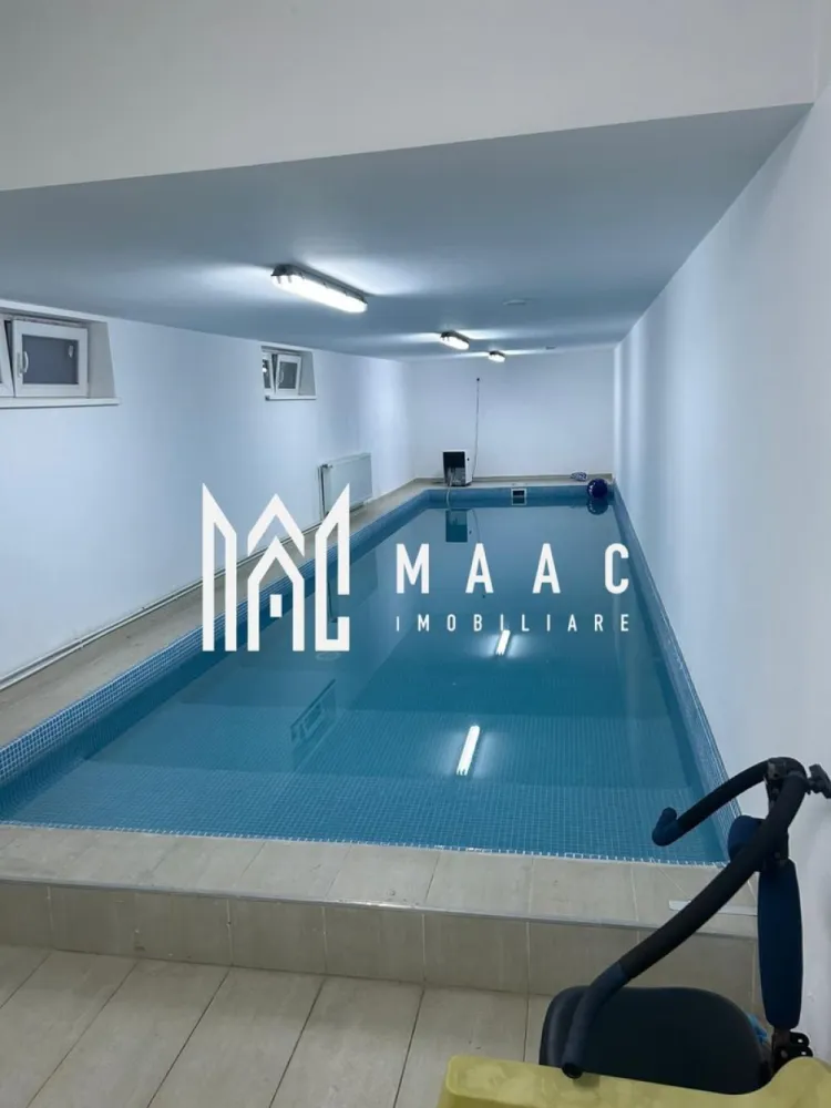 Casa Individuală | 260 MPU | Piscină Interioară | Curte Libera 100 MP - MAAC Imobiliare vă propune spre vânzare o proprietate rară și deosebit de versatilă, situată în Turnișor, într-un cartier liniștit și bine conectat cu orașul.

Descrierea proprietății
Casa este individuală și este formată din două corpuri distincte, oferind multiple posibilități de locuire, relaxare și divertisment.

Corpul 1 – Locuința principală
Suprafață utilă: aprox. 140 mp
Compartimentare: 5 camere, bucătărie, 2 băi, pivniță, pod, cameră tehnică. 
Acest corp oferă spații generoase, luminoase și bine distribuite, potrivite pentru o familie numeroasă sau pentru cei care își doresc confort și intimitate.

Corpul 2 – Relaxare & Entertainment
Piscină interioară – suprafață: aprox. 60 mp
Sală de oaspeți cu bar și biliard – suprafață: aprox. 60 mp
Un spațiu ideal pentru petrecerea timpului liber, organizarea evenimentelor private sau pentru transformarea într-o zonă de wellness completă.

Curtea
Suprafață: aprox. 100 mp
Complet pavată cu pișcoturi de beton
Ușor de întreținut și perfectă pentru parcări sau zonă de recreere exterioară

Alte beneficii
Încălzire centrală proprie
Proprietatea se vinde complet mobilată și utilată
Posibilitate excelentă pentru locuință + zonă de agrement, spațiu de business, casă multifamilială sau investiție 

Pentru mai multe detalii sau pentru a programa o vizionare, vă rugăm să ne contactați, specificând ID: CP2835317