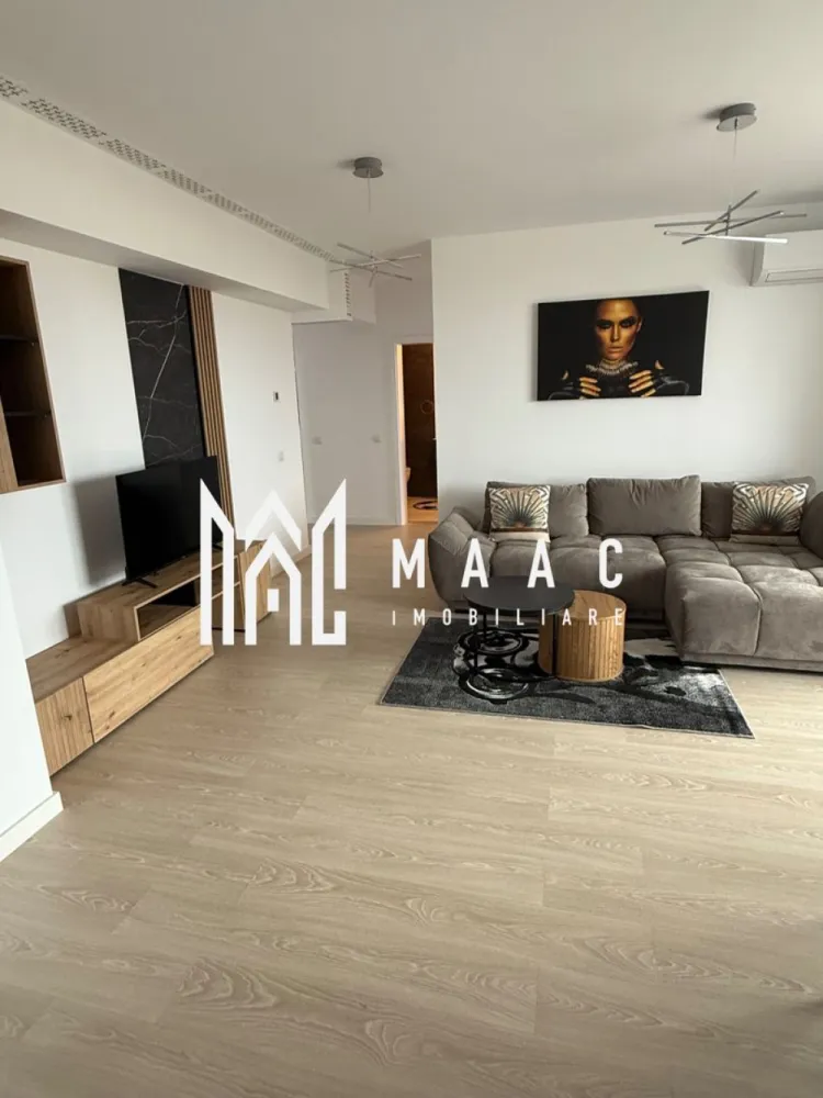 Apartament 3 camere nou | 2 balcoane | Parcare | Decomandat - MAAC IMOBILIARE aduce in atentia dumneavoastra, spre inchiriere, un apartament cu 3 camere, nou, la prima inchiriere, in zona Mihai Viteazu - Doamna Stanca (Evolution Residence). Detalii apartament: • Suprafață: 75 mp • Compartimentare: 3 camere (living+ 2 dormitoare) • Etaj 5 / cu 2 lifturi moderne • 2 balcoane spațioase cu access din living si ambele dormitoare, suprafața balcoane 23mp Dotări si beneficii: • Complet mobilat modern si utilat cu electrocasnice de calitate • Living luminos, open-space, cu bucatarie complet echipata • Dormitoare spațioase, fiecare cu ieșire pe balcon • Baie elegantă, finisaje premium • Bloc nou, dotat cu lifturi rapide si silențioase • Încălzire centrală (prin pardoseala), costuri reduse la întreținere • Loc de parcare disponibil Avantaj zona: • Cartier rezidențial modern si sigur • Acces rapid către centrul orașului • Aproape de supermarketuri, restaurante, Promenada mall, transport public Se percepe garantie in cuantumul unei chirii lunare. Se inchiriaza pe minim 12 luni. Pentru mai multe detalii precizati telefonic ca ati vazut anuntul cu ID: CP2793644