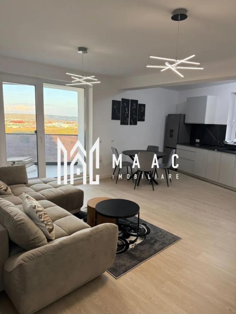 Apartament 3 camere nou | 2 balcoane | Parcare | Decomandat - MAAC IMOBILIARE aduce in atentia dumneavoastra, spre inchiriere, un apartament cu 3 camere, nou, la prima inchiriere, in zona Mihai Viteazu - Doamna Stanca (Evolution Residence). Detalii apartament: • Suprafață: 75 mp • Compartimentare: 3 camere (living+ 2 dormitoare) • Etaj 5 / cu 2 lifturi moderne • 2 balcoane spațioase cu access din living si ambele dormitoare, suprafața balcoane 23mp Dotări si beneficii: • Complet mobilat modern si utilat cu electrocasnice de calitate • Living luminos, open-space, cu bucatarie complet echipata • Dormitoare spațioase, fiecare cu ieșire pe balcon • Baie elegantă, finisaje premium • Bloc nou, dotat cu lifturi rapide si silențioase • Încălzire centrală (prin pardoseala), costuri reduse la întreținere • Loc de parcare disponibil Avantaj zona: • Cartier rezidențial modern si sigur • Acces rapid către centrul orașului • Aproape de supermarketuri, restaurante, Promenada mall, transport public Se percepe garantie in cuantumul unei chirii lunare. Se inchiriaza pe minim 12 luni. Pentru mai multe detalii precizati telefonic ca ati vazut anuntul cu ID: CP2793644