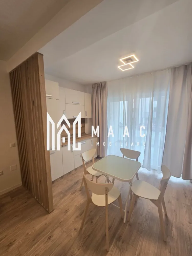 Apartament 2 camere nou | Modern | Balcon | Parcare - MAAC Imobiliare ofera spre inchiriere apartament de 2 camere, nou, complet mobilat si utilat, in zona de vest. mai exact in ansamblul rezidential DaVinci.

*PRIMA INCHIRIERE.

Locuinta are suprafata utila de 52mp si este alcatuita din hol, living open space cu bucatarie cu toate facilitatile, dormitor cu pat matrimonial, baie moderna si terasa de 18mp.

Apartamentul se afla la parterul inalt unui imobil cu regim de inaltime P+1+M, situat la intrarea in Sibiu, in cartierul rezidential DaVinci, care se remarca prin procentul ridicat de spatii verzi, constructii calitative si orientare Sudica la toate locuintele.

Se percepe o chirie in avans si garantie in cuantumul unei chirii lunare. Disponibilitate imediata.

Pentru mai multe detalii, specificati telefonic: CP3208400