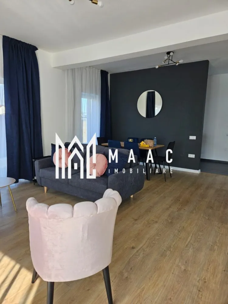 Casă modernă |4 Camere | Curte | 180 mp | Garaj | Șelimbăr - MAAC Imobiliare vă propune spre închiriere o casă spațioasă cu 4 camere, situată în Șelimbăr, ideală pentru o familie care își dorește confort, spațiu și intimitate.

Locuința are o suprafață utilă de aproximativ 180 mp și este compartimentată eficient pentru a oferi funcționalitate și confort.

Compartimentare:
• living spațios
• bucătărie închisă, complet mobilată și utilată
• 3 dormitoare
• 2 băi
• 2 balcoane

Proprietatea dispune de garaj, precum și de o curte generoasă, perfectă pentru relaxare sau petrecerea timpului liber. În curte se regăsește și o filigorie, ideală pentru momentele petrecute în aer liber alături de familie sau prieteni.

Casa este complet mobilată și utilată, fiind pregătită pentru mutare imediată.

Dotări și beneficii:
 încălzire în pardoseală
 garaj
 curte spațioasă
 filigorie în curte
 mobilată și utilată complet
 zonă liniștită, ideală pentru locuit

Această proprietate reprezintă o alegere excelentă pentru cei care își doresc confortul unei case spațioase, într-o zonă apreciată din Șelimbăr.

 Pentru mai multe detalii sau pentru programarea unei vizionări, vă rugăm să ne contactați, specificând ID:CP2955557