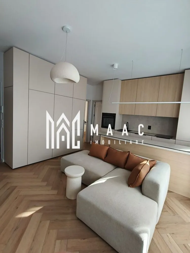 Apartament 2 camere | Turnișor, Sibiu | 50 mp, etaj 1 - Apartament de 2 camere în Turnișor, Sibiu, cu 50 mp utili și etaj 1, disponibil imediat. Loc de parcare inclus și o configurare practică pentru locuire de zi cu zi.

Detalii proprietate:
• 50 mp utili, 65 mp construiți
• Etaj 1
• Living open-space cu bucătărie complet utilată
• Dormitor mobilat și cameră suplimentară ce poate fi amenajată după nevoie
• Încălzire în pardoseală și centrală proprie
• Electrocasnice încorporate, mașină de spălat vase, mașină de spălat rufe cu uscător și Smart TV
• Curte interioară cu acces securizat prin barieră
• Loc de parcare inclus și posibilitatea utilizării unor locuri suplimentare

Zona: Turnișor, Sibiu.

Contactați-ne pentru o vizionare. Cod anunț CP2977210.