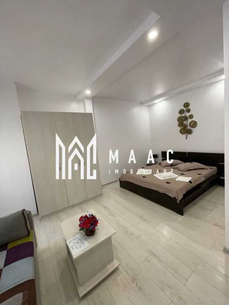 Casă cu 4 camere de vânzare | zona Ultracentrala - MAAC Imobiliare va propune spre vanzare o vilă tip hotelier, complet funcțională, situată ultracentral în Sibiu – una dintre cele mai căutate destinații turistice din România.

Imobilul a fost construit în anul 2012 – un avantaj major și o raritate pentru zona centrală a Sibiului – și a fost complet renovat în 2018, oferind standarde moderne de confort și siguranță.
Proprietatea este ideală pentru regim hotelier sau închiriere în scop turistic, având deja toate autorizațiile necesare și fiind pregătită pentru preluare imediată.

Caracteristici principale:
Suprafață utilă: aproximativ 90 mp
4 unități de cazare
4 dormitoare, fiecare cu baie proprie
Compartimentare eficientă, optimizată pentru exploatare turistică
Complet mobilată și utilată

Avantaje investiționale:
Certificare Ministerul Turismului – clasificare 3 stele
Afacere la cheie – gata de preluat și exploatat imediat
Locație ultracentrală, cu acces rapid la principalele atracții turistice
Flux constant de turiști pe tot parcursul anului
Randament excelent din închiriere în regim hotelier

Imobilul se predă complet mobilat și utilat, fiind disponibil imediat pentru mutare sau pentru utilizare ca investiție într-o zonă centrală cu potențial ridicat.

Această proprietate reprezintă o investiție sigură și profitabilă, fiind deja funcțională și poziționată într-o zonă premium. Ideală pentru investitori care doresc venituri imediate fără bătăi de cap.
Locația este una deosebită atât din punct de vedere arhitectural, cât și al amplasamentului, fiind situată în centrul civic și cultural al orașului Sibiu, înconjurată de monumente istorice și culturale, teatre, muzee și zone cu ziduri de fortificație.
Oportunitate rară de investiție!
Pentru mai multe detalii, vă rugăm să menționați telefonic că ați văzut anunțul cu CP2984595.