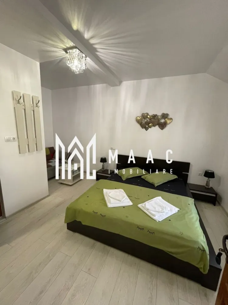 Casă cu 4 camere de vânzare | zona Ultracentrala - MAAC Imobiliare va propune spre vanzare o vilă tip hotelier, complet funcțională, situată ultracentral în Sibiu – una dintre cele mai căutate destinații turistice din România.

Imobilul a fost construit în anul 2012 – un avantaj major și o raritate pentru zona centrală a Sibiului – și a fost complet renovat în 2018, oferind standarde moderne de confort și siguranță.
Proprietatea este ideală pentru regim hotelier sau închiriere în scop turistic, având deja toate autorizațiile necesare și fiind pregătită pentru preluare imediată.

Caracteristici principale:
Suprafață utilă: aproximativ 90 mp
4 unități de cazare
4 dormitoare, fiecare cu baie proprie
Compartimentare eficientă, optimizată pentru exploatare turistică
Complet mobilată și utilată

Avantaje investiționale:
Certificare Ministerul Turismului – clasificare 3 stele
Afacere la cheie – gata de preluat și exploatat imediat
Locație ultracentrală, cu acces rapid la principalele atracții turistice
Flux constant de turiști pe tot parcursul anului
Randament excelent din închiriere în regim hotelier

Imobilul se predă complet mobilat și utilat, fiind disponibil imediat pentru mutare sau pentru utilizare ca investiție într-o zonă centrală cu potențial ridicat.

Această proprietate reprezintă o investiție sigură și profitabilă, fiind deja funcțională și poziționată într-o zonă premium. Ideală pentru investitori care doresc venituri imediate fără bătăi de cap.
Locația este una deosebită atât din punct de vedere arhitectural, cât și al amplasamentului, fiind situată în centrul civic și cultural al orașului Sibiu, înconjurată de monumente istorice și culturale, teatre, muzee și zone cu ziduri de fortificație.
Oportunitate rară de investiție!
Pentru mai multe detalii, vă rugăm să menționați telefonic că ați văzut anunțul cu CP2984595.