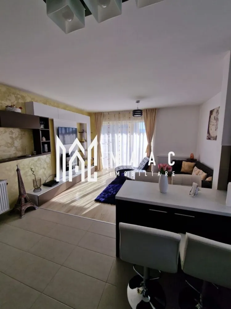 Apartament 3 camere Sibiu | Mihai Viteazul | nedecomandat, balcon - Apartament cu 3 camere de închiriat în Sibiu, zona Mihai Viteazul, cu 64 mp utili, balcon și mobilare completă, situat aproape de Dedeman.

Detalii proprietate:
• Suprafață utilă: 64 mp
• Compartimentare: nedecomandat
• Configurație cu 2 dormitoare și living open space cu bucătăria
• Etaj 2
• An construcție: 2000
• Se închiriază complet mobilat și utilat
• Balcon
• Aparat de aer condiționat montat recent în living

Proprietatea este amplasată în zona Mihai Viteazul, în apropiere de Dedeman, reper util pentru orientare și accesul de zi cu zi în oraș.

Pentru detalii suplimentare și programarea unei vizionări, contactați echipa MAAC Imobiliare și menționați Cod anunț CP3213032.

Conținut optimizat cu AI, aprobat de agent uman.