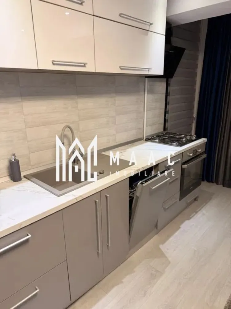 Apartament 2 camere | Șelimbăr – Doamna Stanca | Lângă Kaufland - MAAC Imobiliare vă propune spre închiriere un apartament modern cu 2 camere, situat în Șelimbăr, pe strada Doamna Stanca, într-un complex rezidențial apreciat, aflat în imediata apropiere a Kaufland Șelimbăr și la doar câteva minute de Shopping City Sibiu.

Locuința are o suprafață utilă de 58 mp (exclus balcon) și este compartimentată eficient, oferind un spațiu bine organizat:

living open space cu bucătărie complet echipată
dormitor spațios
baie modernă, dotată cu duș walk-in

Apartamentul este complet mobilat și utilat cu mobilier modern și electrocasnice de calitate, fiind pregătit pentru mutare imediată. Printre dotări se numără:

mașină de spălat rufe cu uscător (LG 2 în 1)
mașină de spălat vase
frigider, aragaz și cuptor
aer condiționat
televizoare în fiecare cameră
finisaje premium (parchet, gresie, faianță tip mozaic)

Imobilul dispune de locuri de parcare în regim „primul venit – primul servit”, însă locul de parcare nu este inclus în prețul chiriei.

Condiții de închiriere:
nu se acceptă animale de companie
disponibilitate imediata.

Pentru mai multe detalii și programarea unei vizionări, vă invităm să ne contactați, menționând ID-ul ofertei:CP2978046