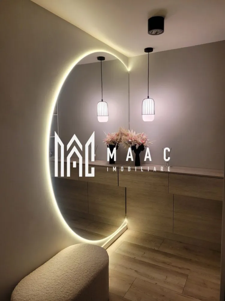 Duplex | 210 mp | Curte 200 mp | 5 Camere | 3 Băi | Șelimbăr - MAAC Imobiliare vă propune spre vânzare o casă spațioasă și elegantă, ideală pentru o familie care își dorește confort, funcționalitate și un ambient modern, bine organizat. Proprietatea beneficiază de o suprafață utilă de 211 mp și o curte de aproximativ 200 mp, oferind un echilibru optim între spațiul interior generos și zona exterioară dedicată relaxării.

Locuința este compartimentată inteligent, cu încăperi luminoase și bine dimensionate, fiind potrivită atât pentru locuire permanentă, cât și pentru investiție pe termen lung. Se vinde complet mobilată și utilată, cu finisaje de calitate, gata pentru mutare imediată fără necesitatea unor investiții suplimentare.

Compartimentare:
-5 camere spațioase, ideale pentru living, dormitoare sau birou
-dressing generos de 14 mp
-3 băi moderne, amenajate cu atenție la detalii

Exterior:
-curte privată de aproximativ 200 mp, ideală pentru relaxare sau amenajare spațiu verde
-carport pentru protecția mașinii

Proprietatea se evidențiază prin suprafețele generoase, compartimentarea practică și atmosfera primitoare, fiind o alegere excelentă pentru cei care caută o locuință complet echipată într-un cadru confortabil.

Pentru mai multe detalii, vă rugăm să menționați CP2988696 la telefon.